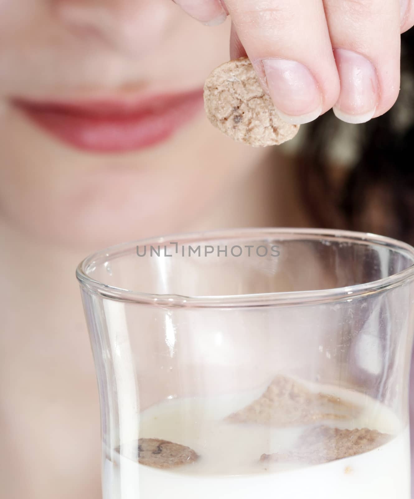 Young people eating milk with cereals by arosoft