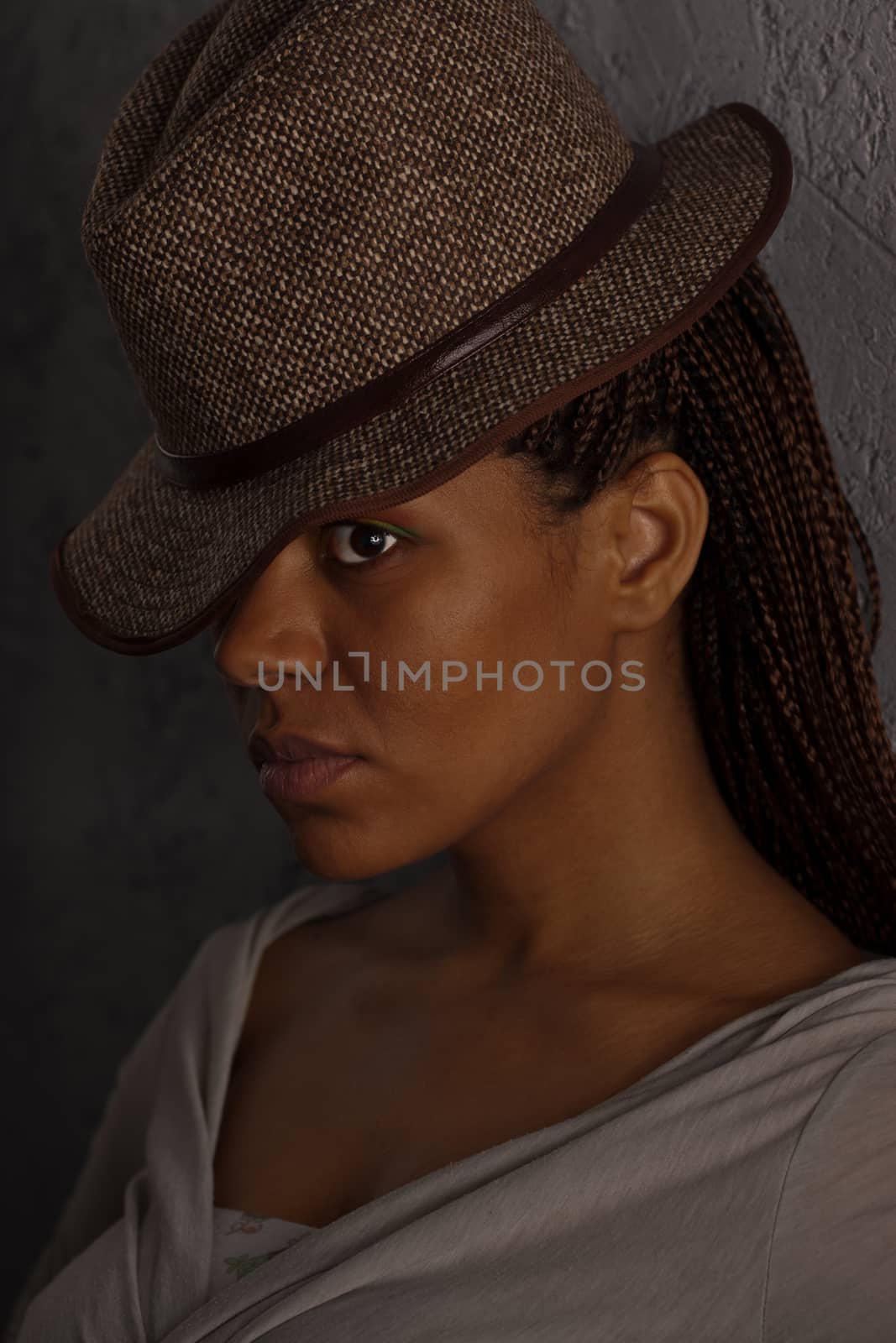 dark portrait of a girl in hat by Astroid