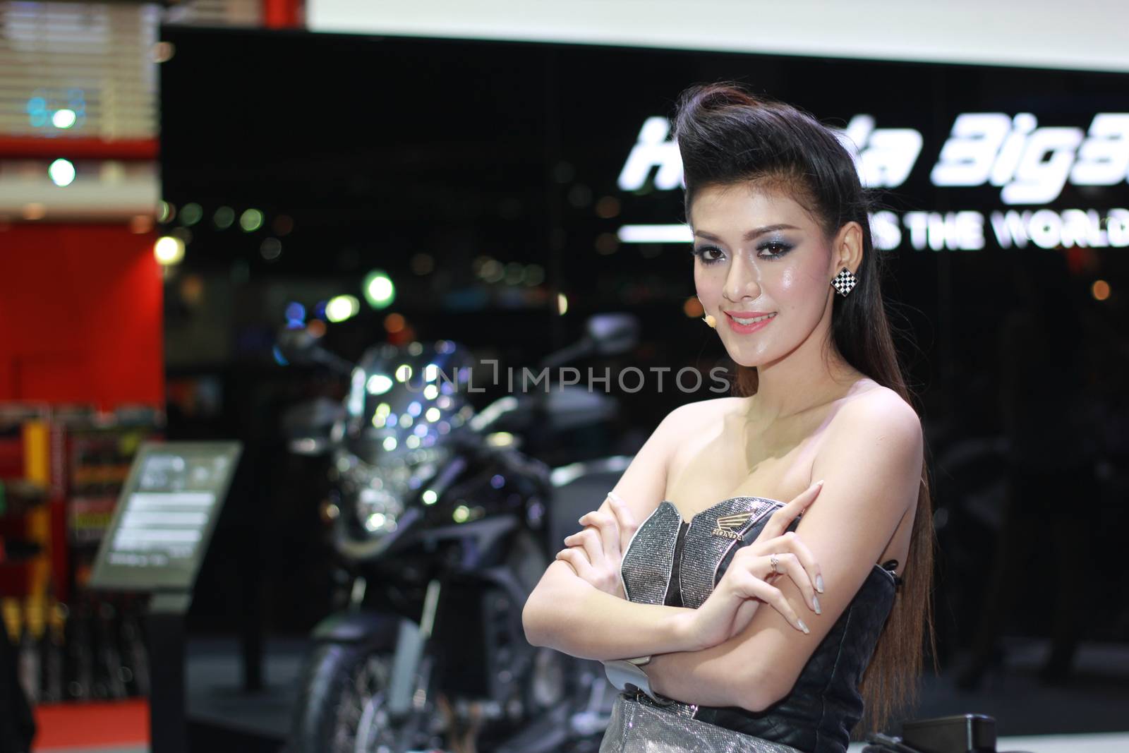 BANGKOK, THAILAND - MARCH 30, 2014: Unidentified female presenter pose in the 35th Bangkok International Motor Show on March 30, 2014 in Nonthaburi, Thailand.