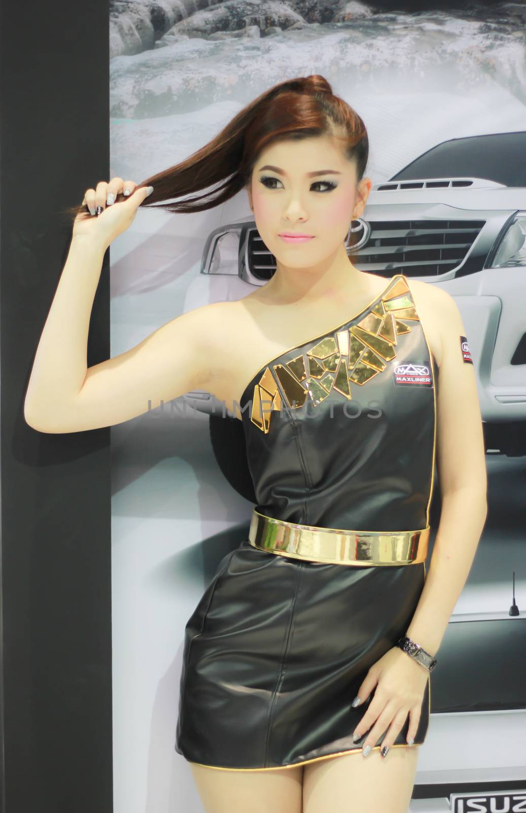 BANGKOK, THAILAND - MARCH 30, 2014: Unidentified female presenter pose in the 35th Bangkok International Motor Show on March 30, 2014 in Nonthaburi, Thailand.