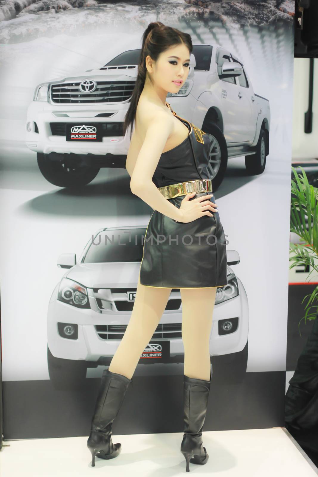 BANGKOK, THAILAND - MARCH 30, 2014: Unidentified female presenter pose in the 35th Bangkok International Motor Show on March 30, 2014 in Nonthaburi, Thailand.