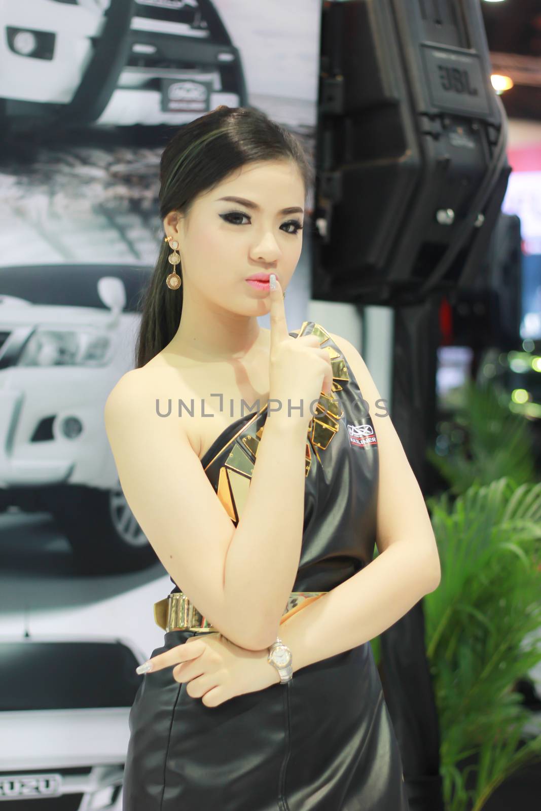 BANGKOK, THAILAND - MARCH 30, 2014: Unidentified female presenter pose in the 35th Bangkok International Motor Show on March 30, 2014 in Nonthaburi, Thailand.