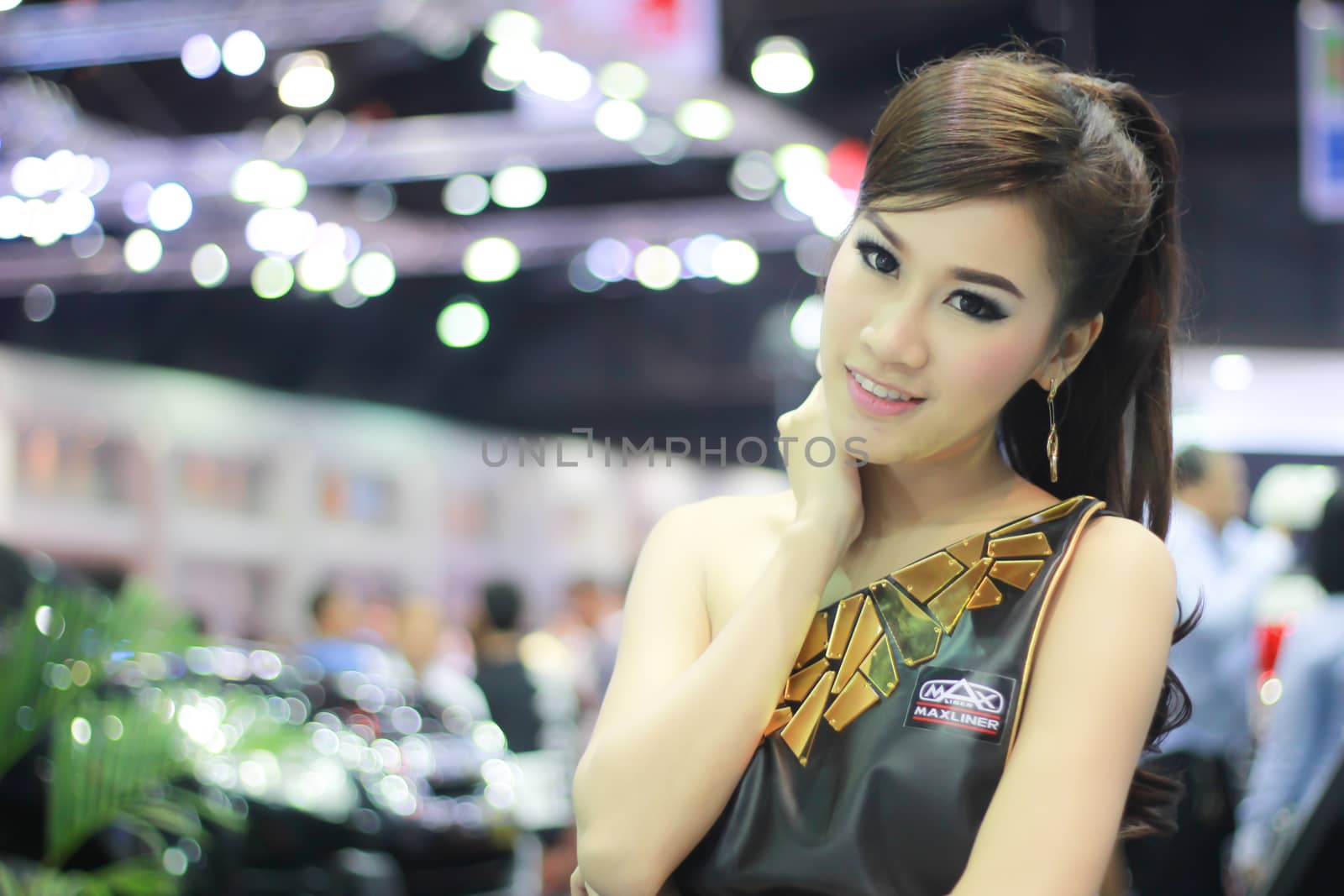 BANGKOK, THAILAND - MARCH 30, 2014: Unidentified female presenter pose in the 35th Bangkok International Motor Show on March 30, 2014 in Nonthaburi, Thailand.