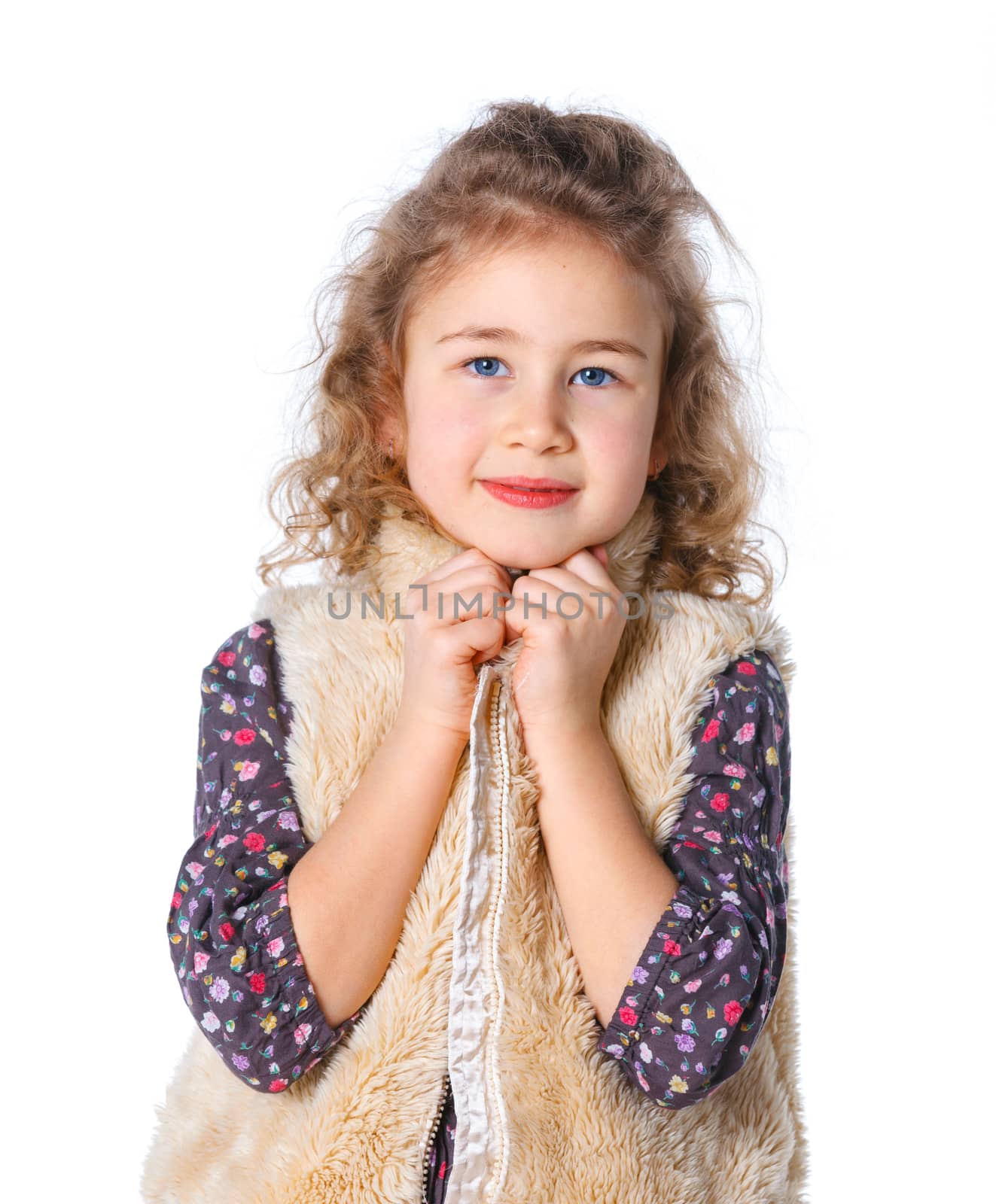 A beautiful young girl dressed for winter, over a white background