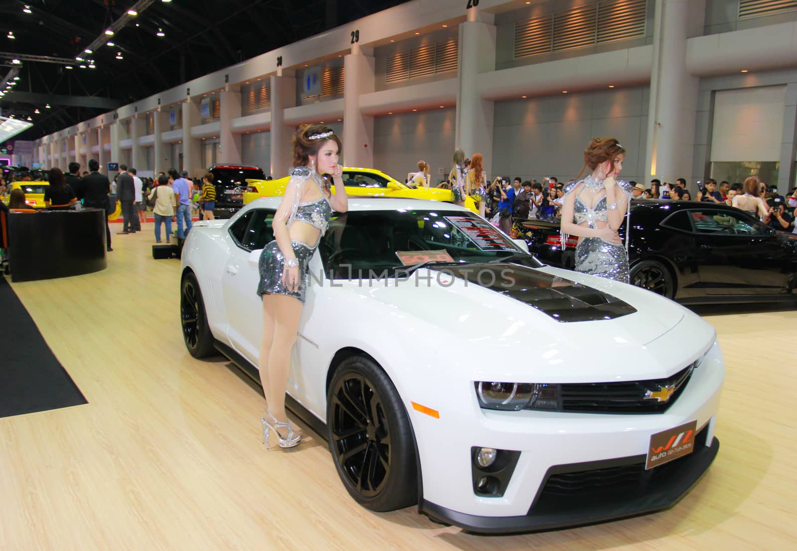 BANGKOK, THAILAND - MARCH 30, 2014: Unidentified female presenter pose in the 35th Bangkok International Motor Show on March 30, 2014 in Nonthaburi, Thailand.