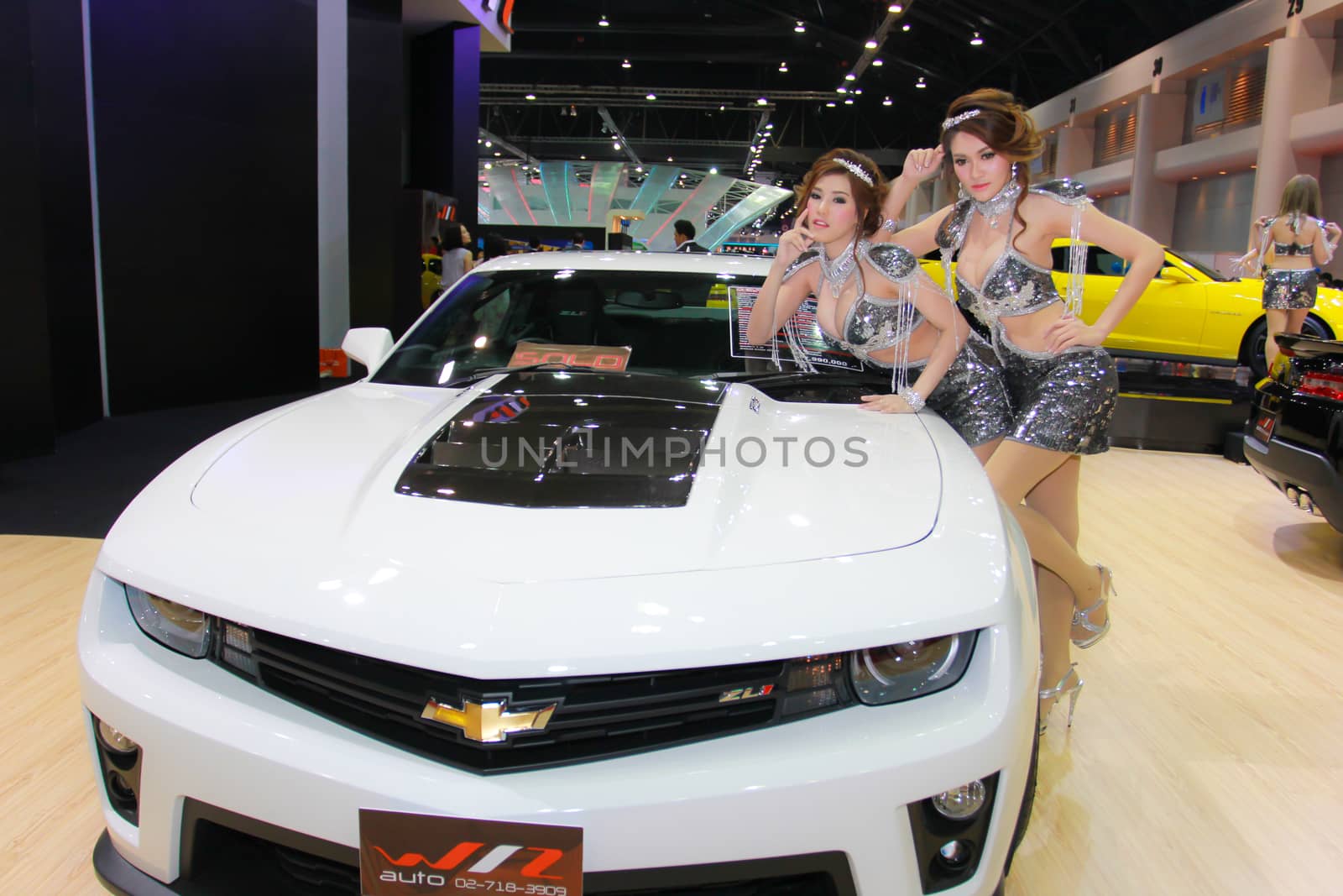 BANGKOK, THAILAND - MARCH 30, 2014: Unidentified female presenter pose in the 35th Bangkok International Motor Show on March 30, 2014 in Bangkok, Thailand.