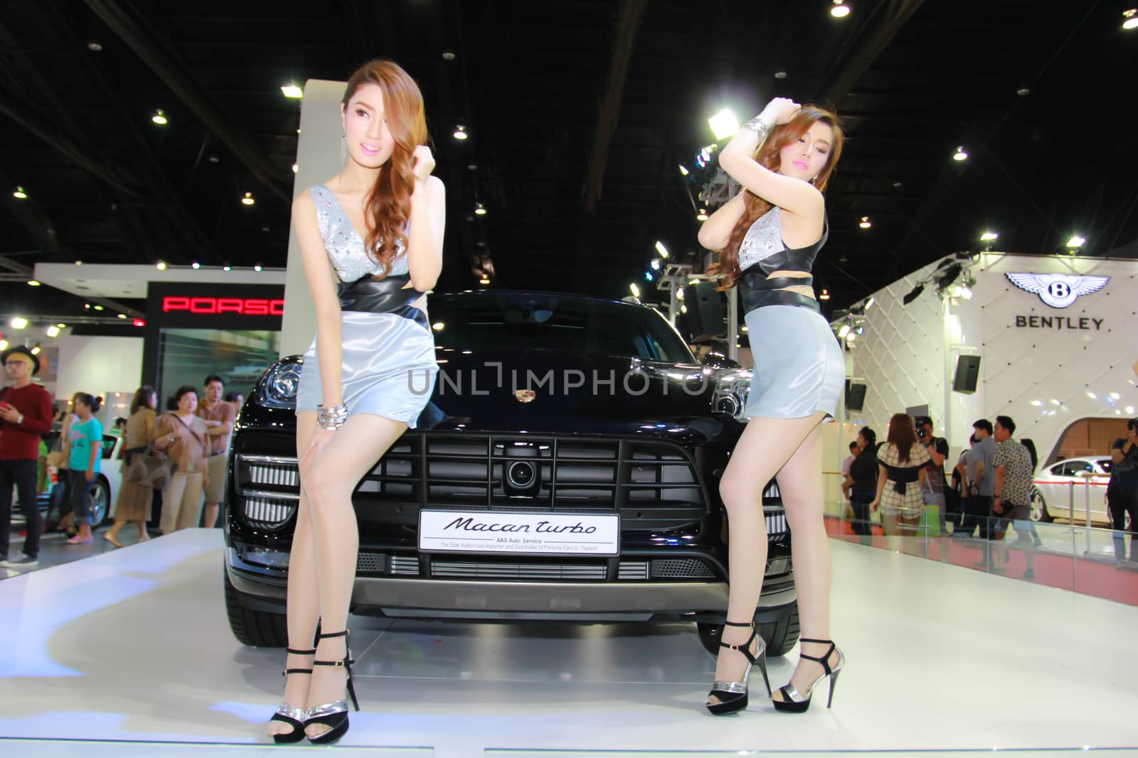 BANGKOK, THAILAND - MARCH 30, 2014: Unidentified female presenter pose in the 35th Bangkok International Motor Show on March 30, 2014 in Bangkok, Thailand.