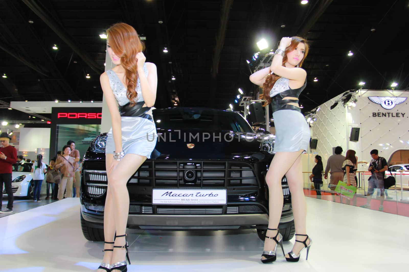 BANGKOK, THAILAND - MARCH 30, 2014: Unidentified female presenter pose in the 35th Bangkok International Motor Show on March 30, 2014 in Bangkok, Thailand.