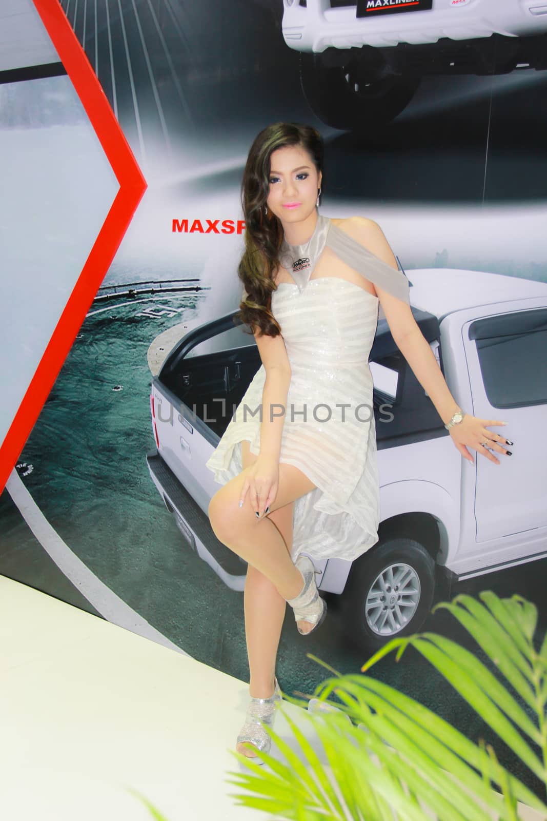 BANGKOK, THAILAND - MARCH 30, 2014: Unidentified female presenter pose in the 35th Bangkok International Motor Show on March 30, 2014 in Bangkok, Thailand.