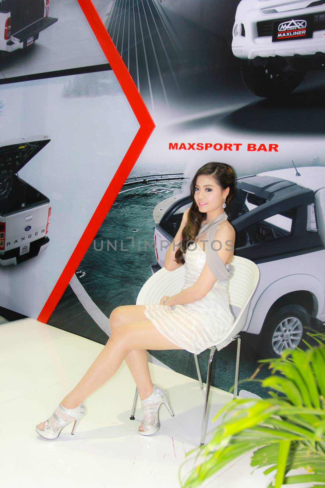 BANGKOK, THAILAND - MARCH 30, 2014: Unidentified female presenter pose in the 35th Bangkok International Motor Show on March 30, 2014 in Bangkok, Thailand.