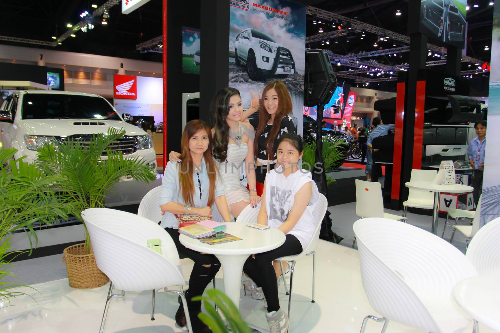 BANGKOK, THAILAND - MARCH 30, 2014: Unidentified female presenter pose in the 35th Bangkok International Motor Show on March 30, 2014 in Bangkok, Thailand.