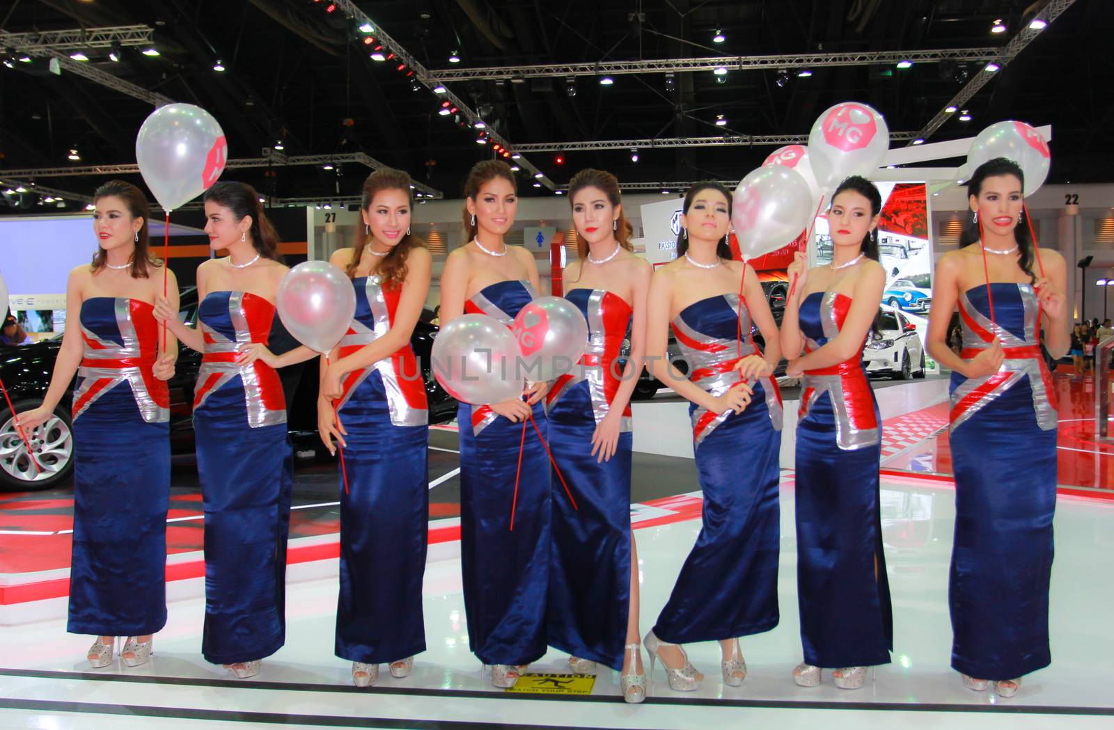 BANGKOK, THAILAND - MARCH 30, 2014: Unidentified female presenter pose in the 35th Bangkok International Motor Show on March 30, 2014 in Bangkok, Thailand.