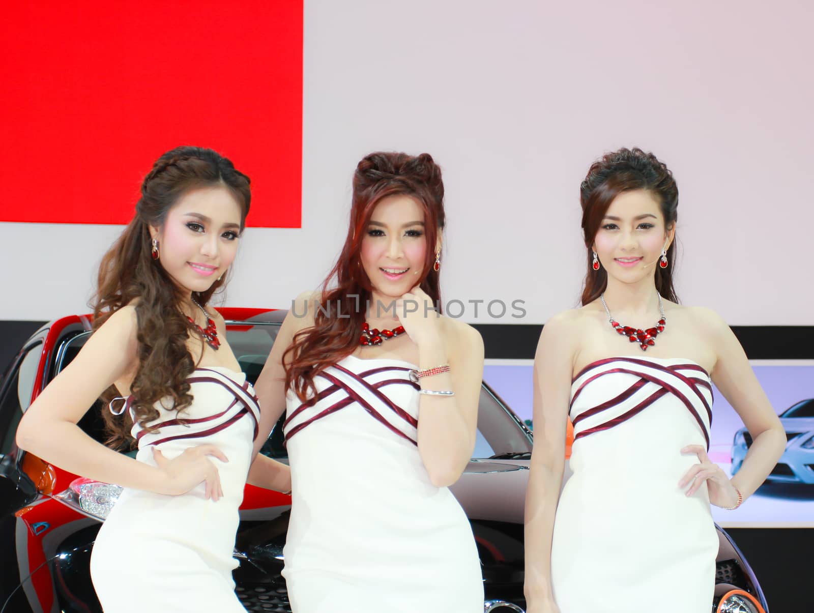 BANGKOK, THAILAND - MARCH 30, 2014: Unidentified female presenter pose in the 35th Bangkok International Motor Show on March 30, 2014 in Bangkok, Thailand.