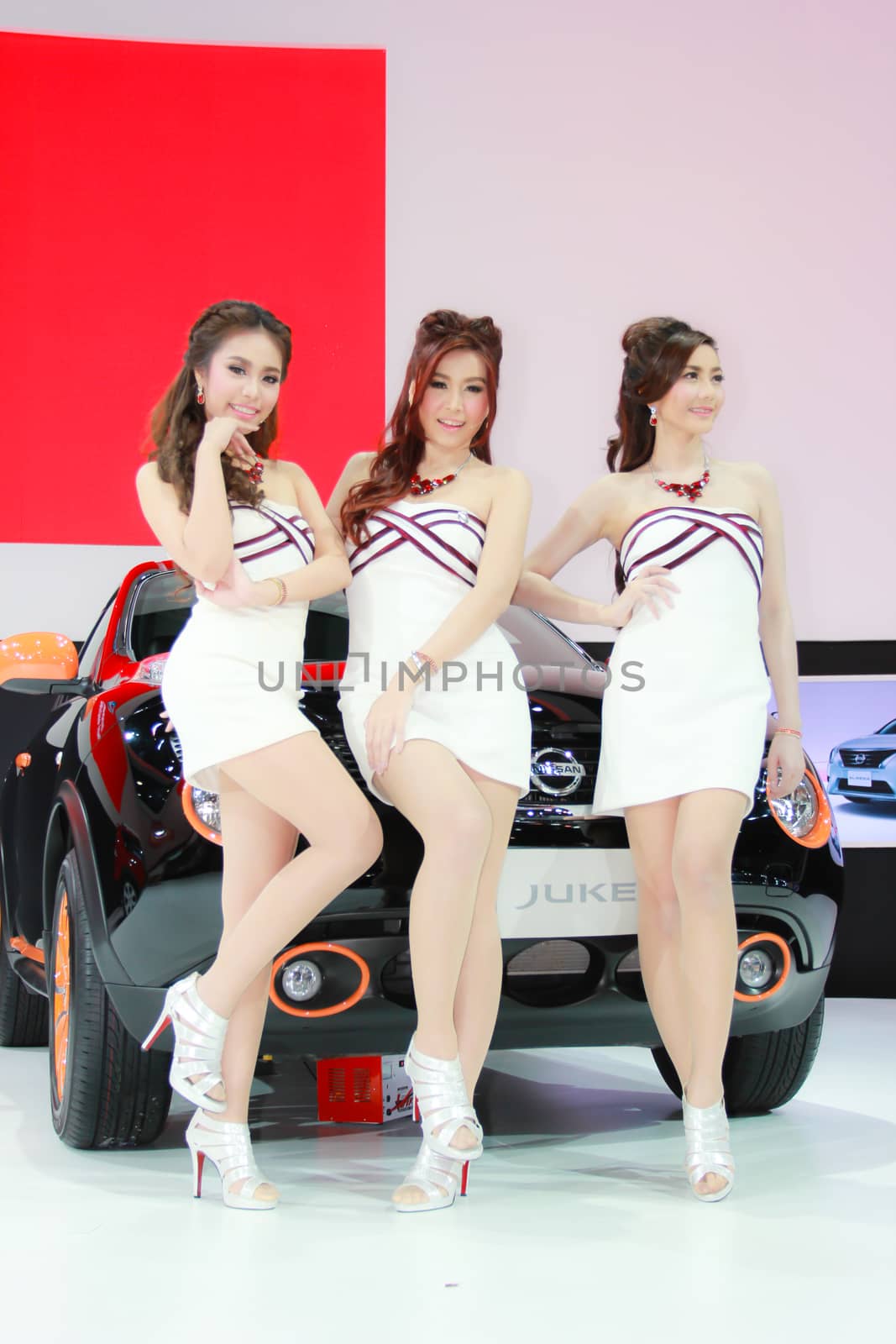 BANGKOK, THAILAND - MARCH 30, 2014: Unidentified female presenter pose in the 35th Bangkok International Motor Show on March 30, 2014 in Bangkok, Thailand.