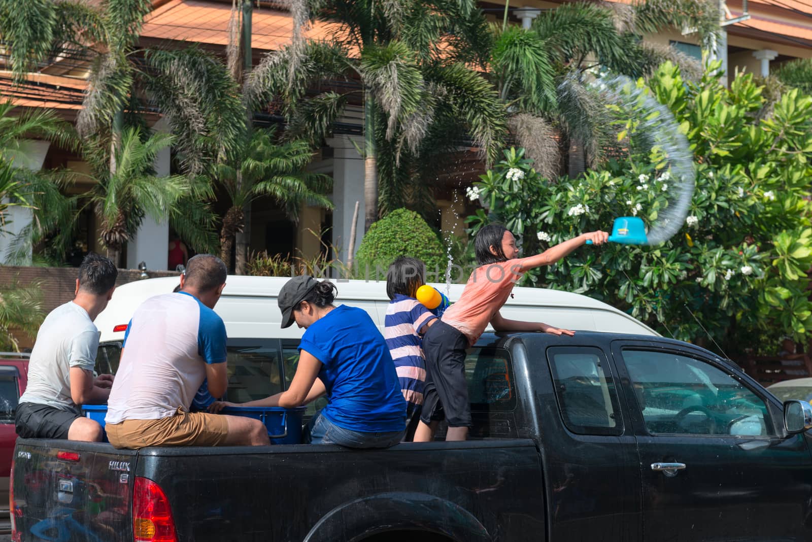 Phuket, Thailand - April 13, 2014: Tourist and residents celebrate Songkran Festival, the Thai New Year by splashing water to each others on Patong streets. 