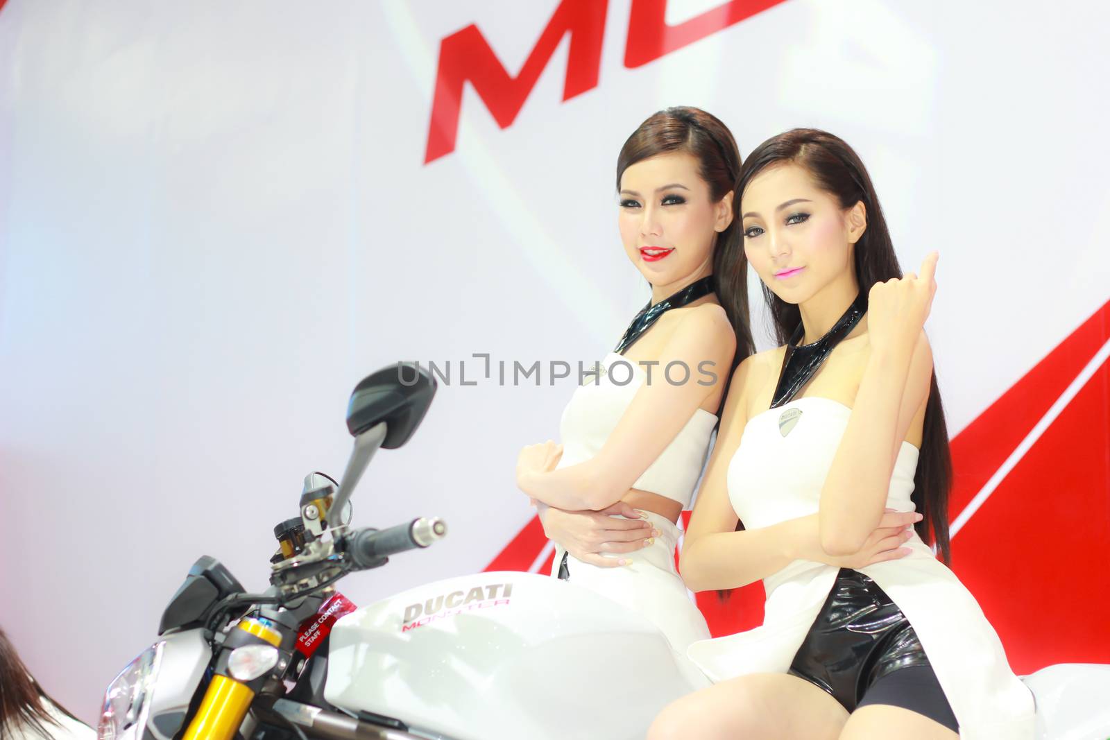 BANGKOK, THAILAND - MARCH 30, 2014: Unidentified female presenter pose in the 35th Bangkok International Motor Show on March 30, 2014 in Bangkok, Thailand.