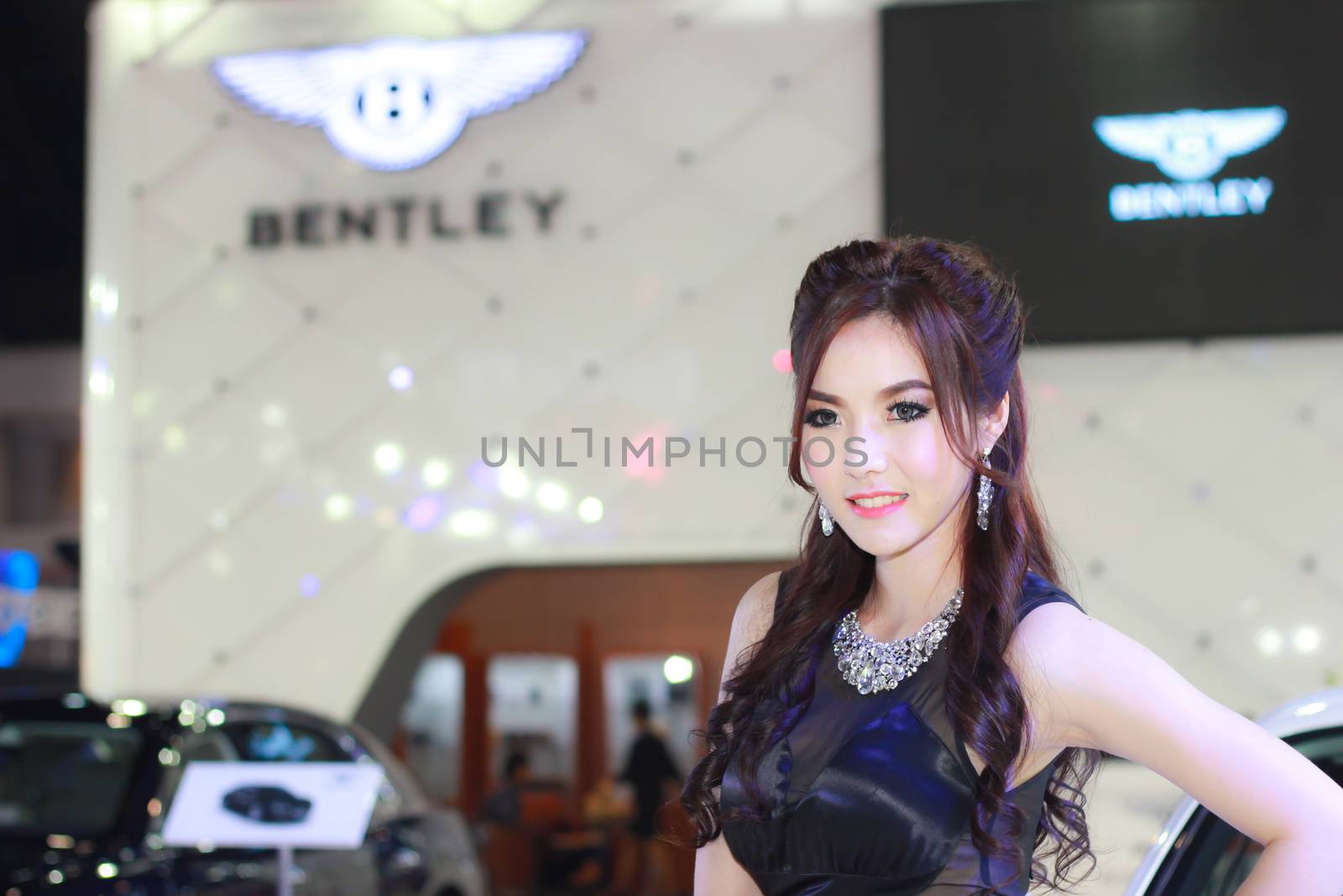 BANGKOK, THAILAND - MARCH 30, 2014: Unidentified female presenter pose in the 35th Bangkok International Motor Show on March 30, 2014 in Bangkok, Thailand.