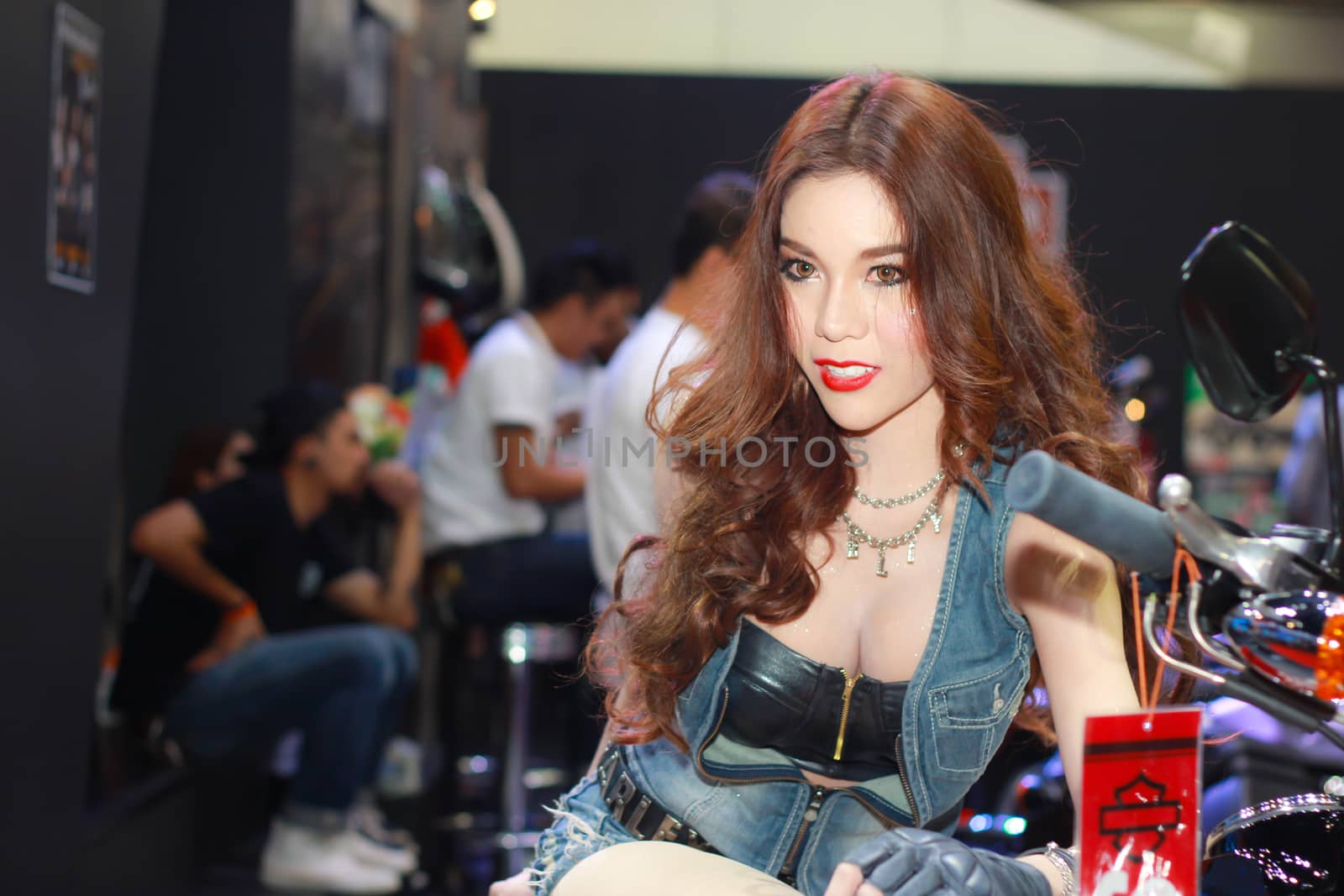 BANGKOK, THAILAND - MARCH 30, 2014: Unidentified female presenter pose in the 35th Bangkok International Motor Show on March 30, 2014 in Bangkok, Thailand.