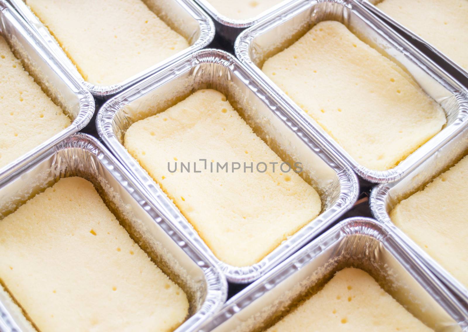 Preparing cheese base square cake, stock photo