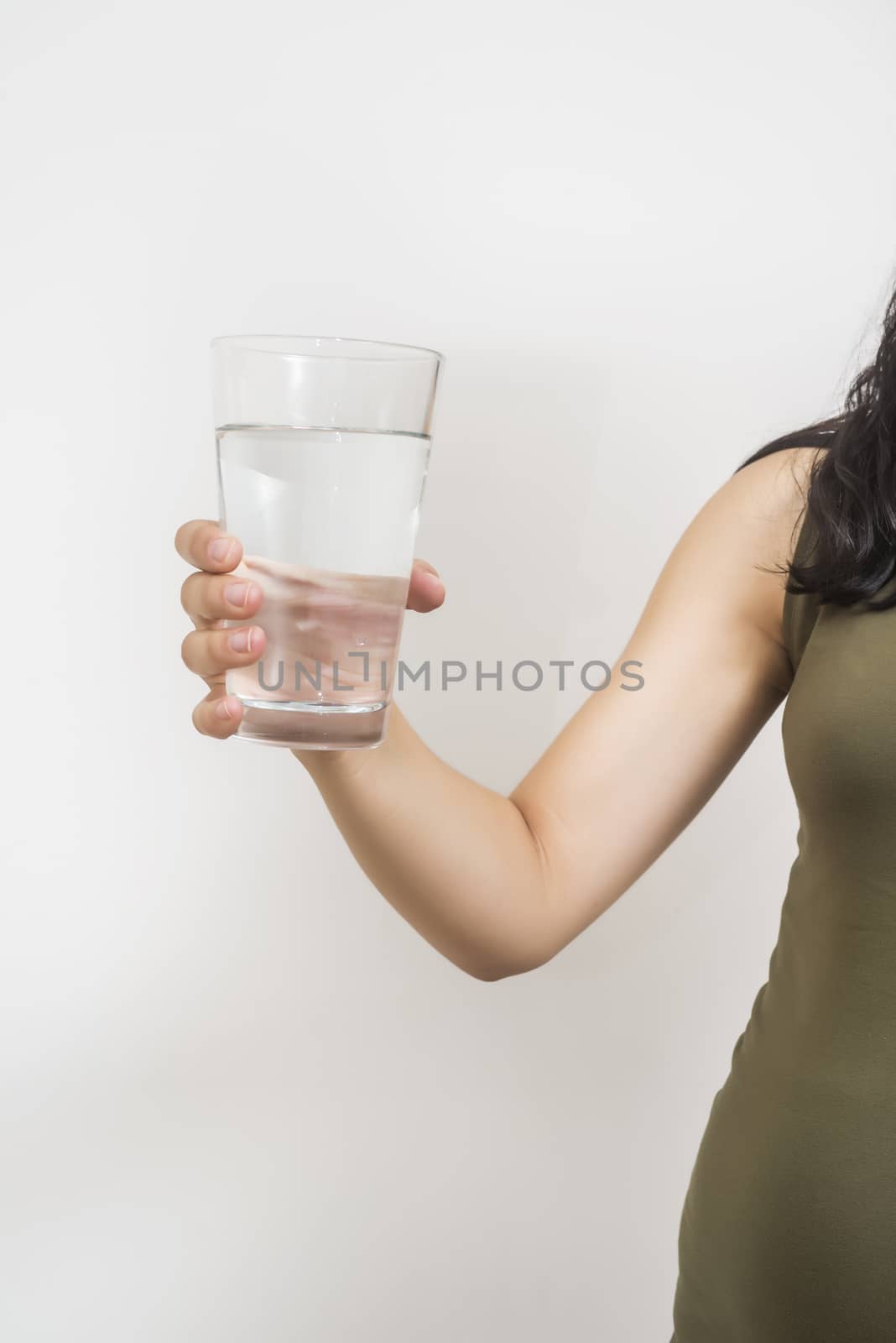 hand holding a glass of water