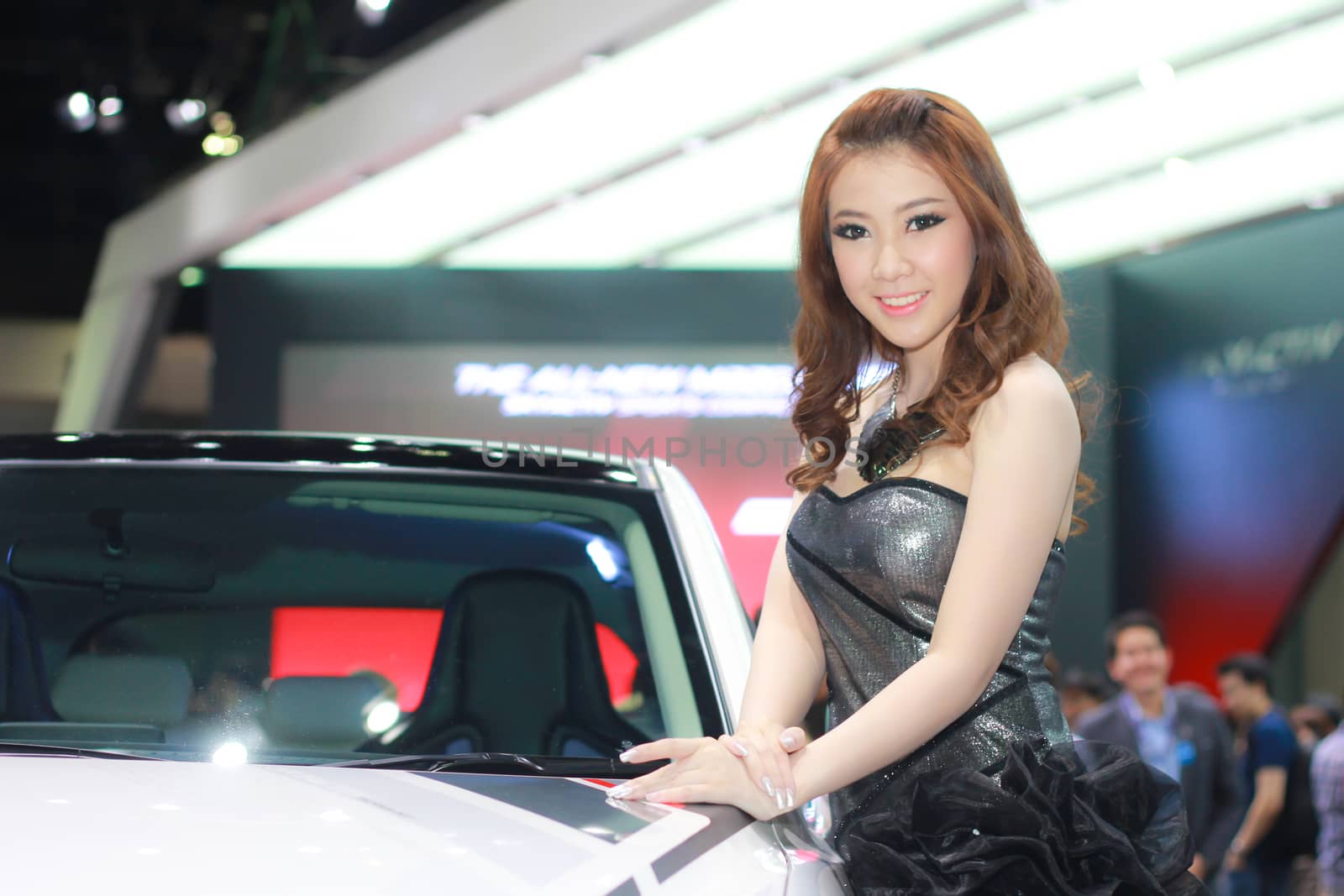 BANGKOK, THAILAND - MARCH 30, 2014: Unidentified female presenter pose in the 35th Bangkok International Motor Show on March 30, 2014 in Bangkok, Thailand.