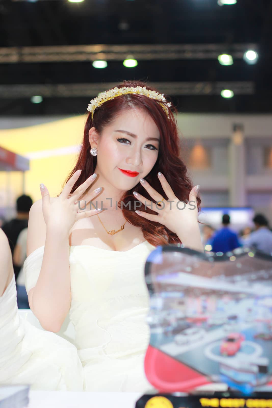 BANGKOK, THAILAND - MARCH 30, 2014: Unidentified female presenter pose in the 35th Bangkok International Motor Show on March 30, 2014 in Bangkok, Thailand.