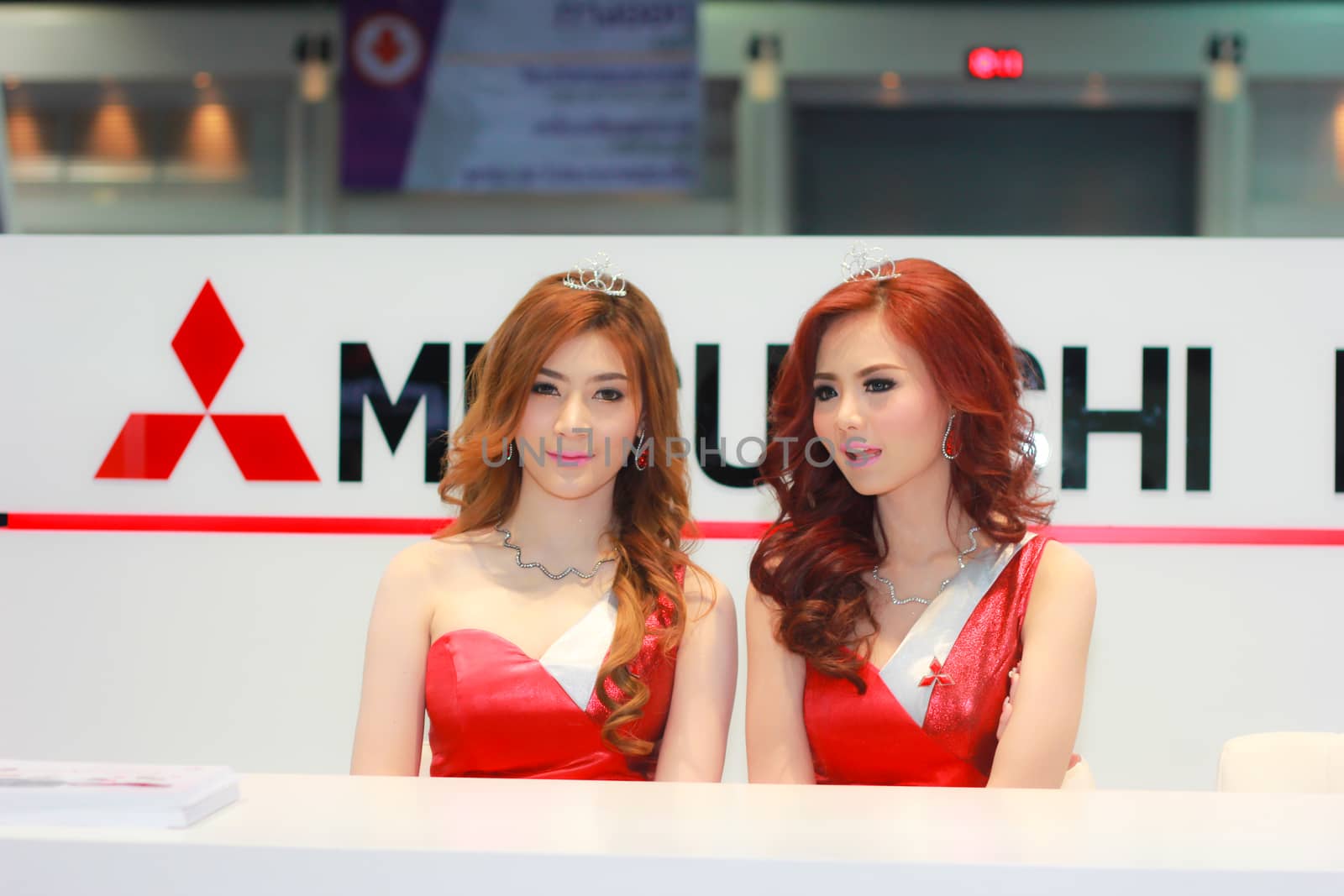 BANGKOK, THAILAND - MARCH 30, 2014: Unidentified female presenter pose in the 35th Bangkok International Motor Show on March 30, 2014 in Bangkok, Thailand.