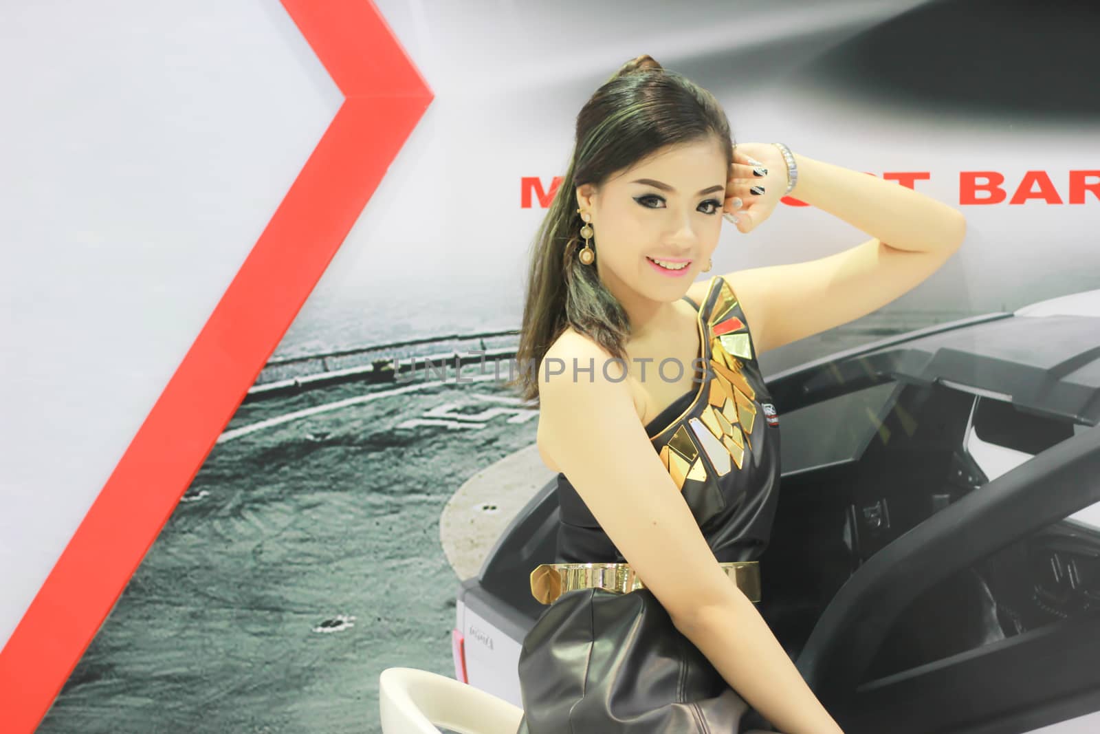 BANGKOK, THAILAND - MARCH 30, 2014: Unidentified female presenter pose in the 35th Bangkok International Motor Show on March 30, 2014 in Nonthaburi, Thailand.