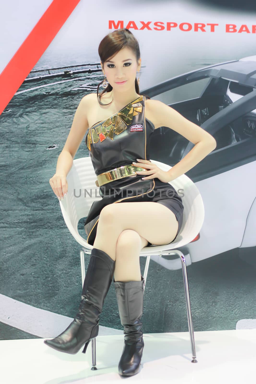 BANGKOK, THAILAND - MARCH 30, 2014: Unidentified female presenter pose in the 35th Bangkok International Motor Show on March 30, 2014 in Nonthaburi, Thailand.