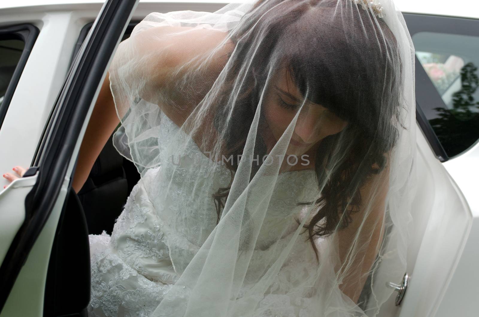 Beautiful South African bride leaving car on way to wedding