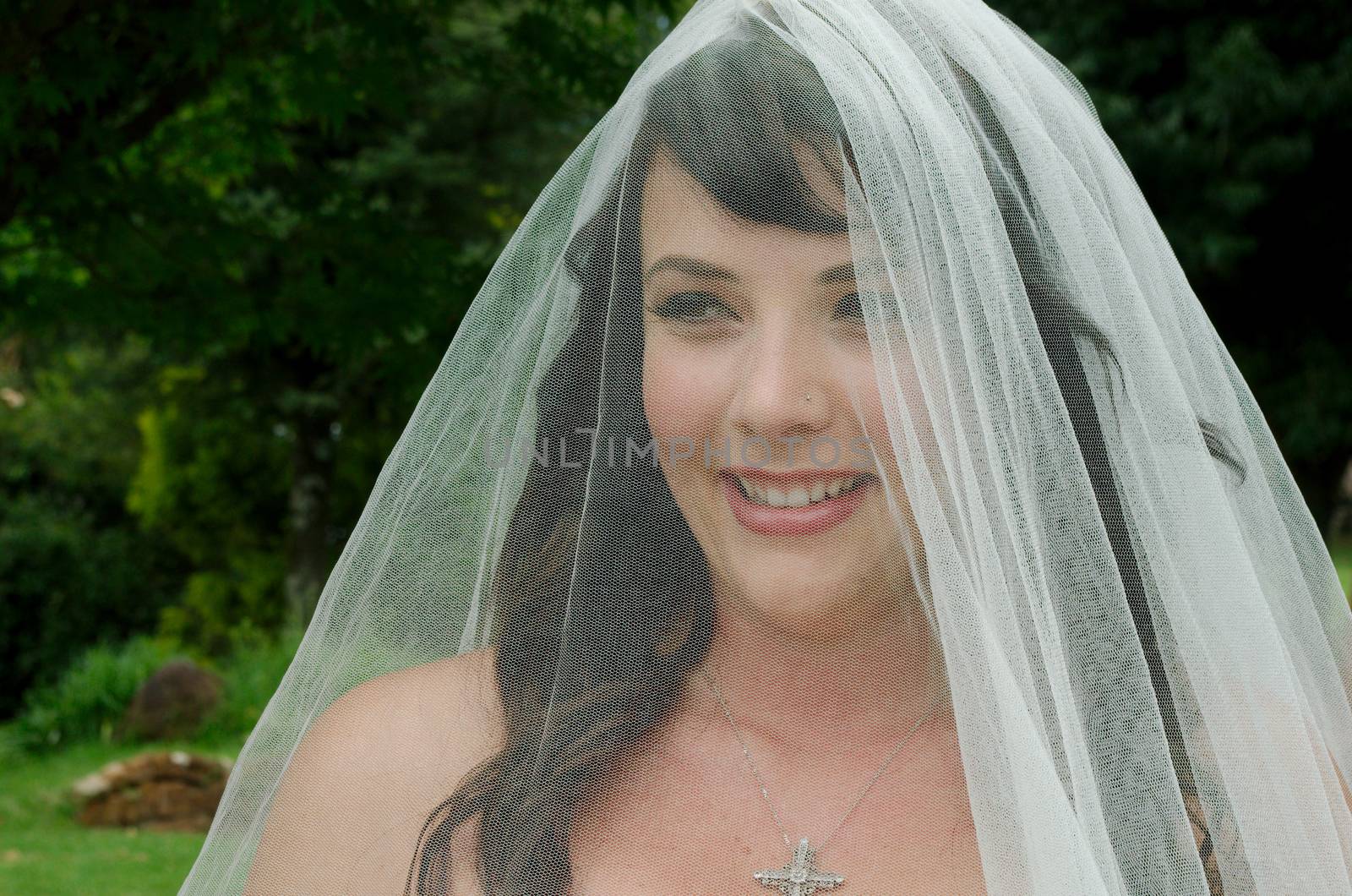 Beautiful South African bride outside church on way to wedding