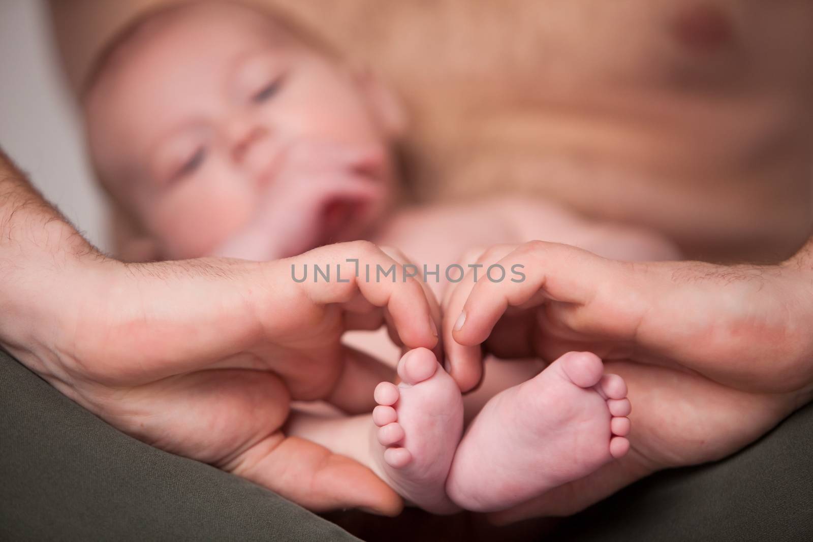 Little baby with his little feet in a heart shape by DNFStyle