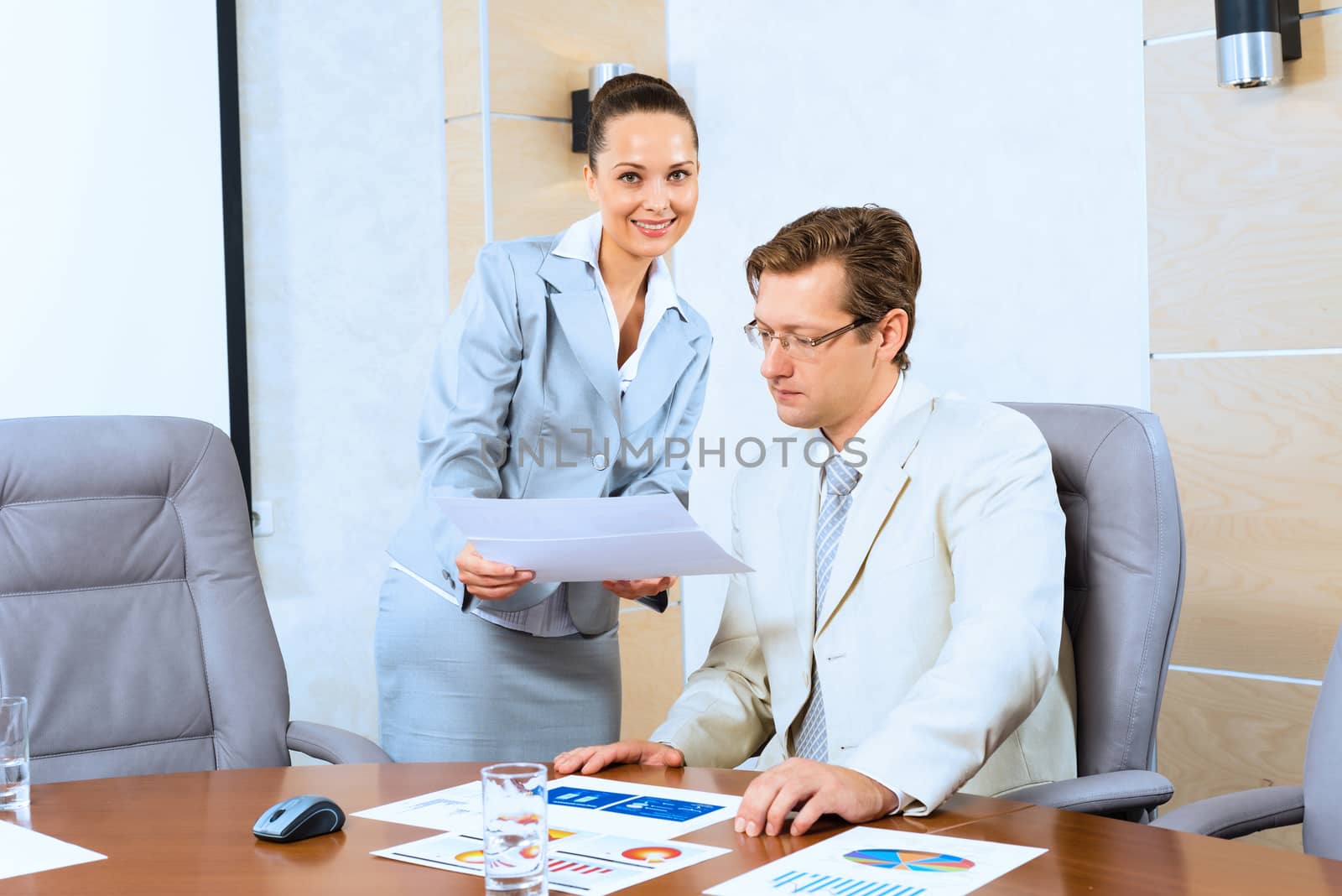 image of a two businessmen discussing documents, teamwork