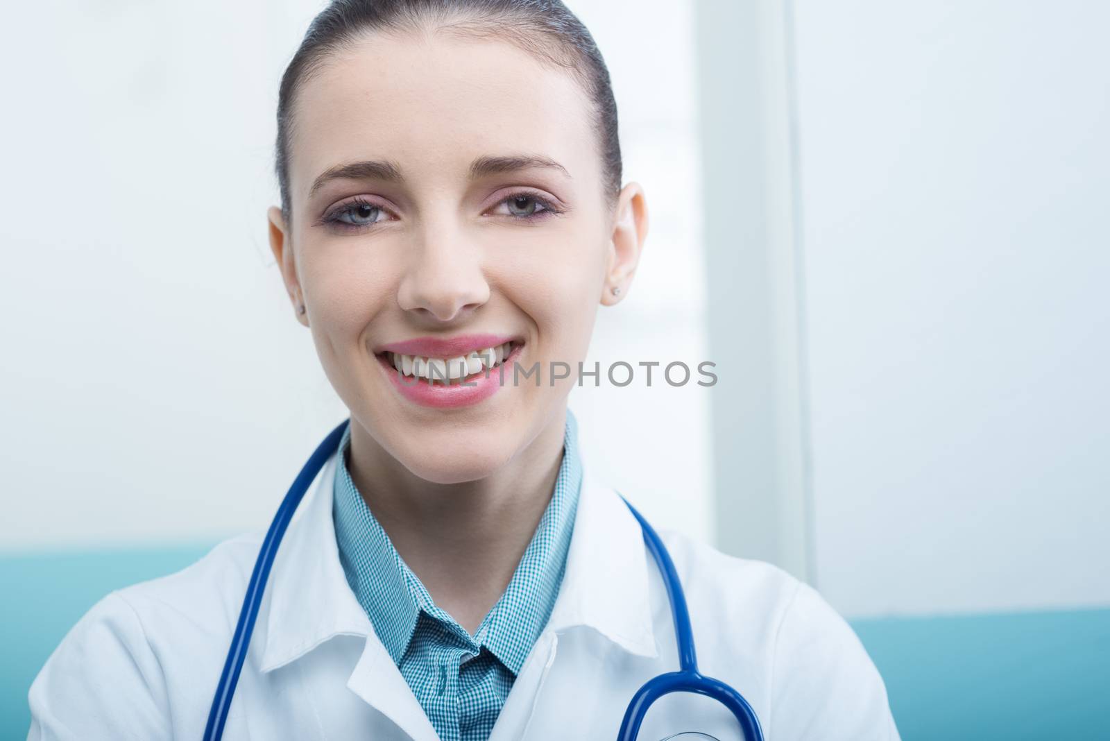 Close up portrait of a young female doctor smiling