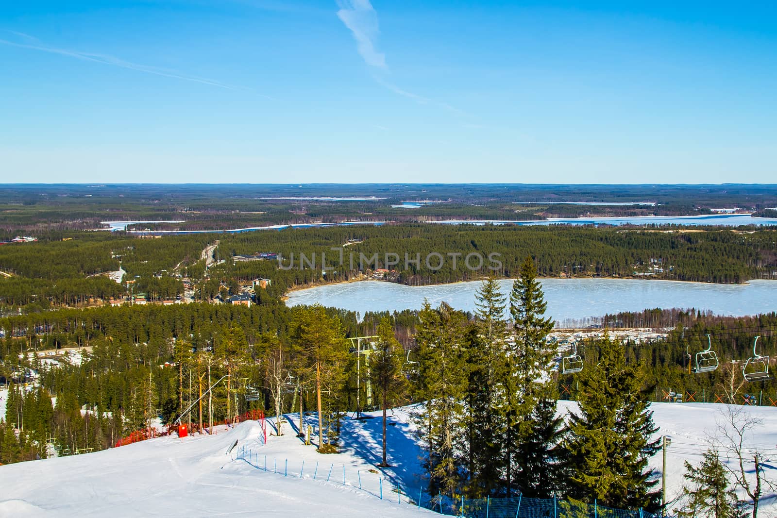 Forest and lakes view over ski slope in northern Finland