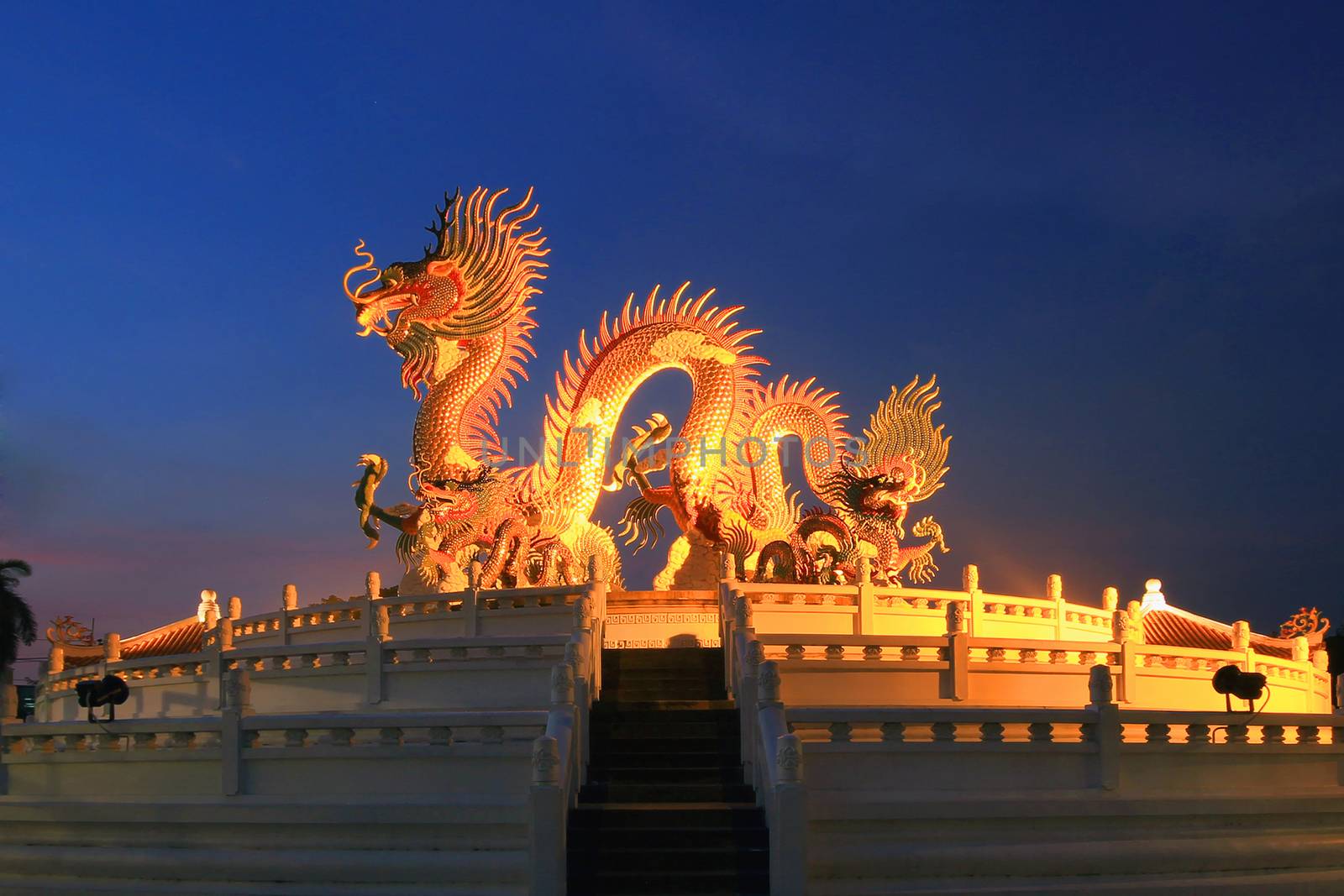 Chinese dragon statue at the twilight time