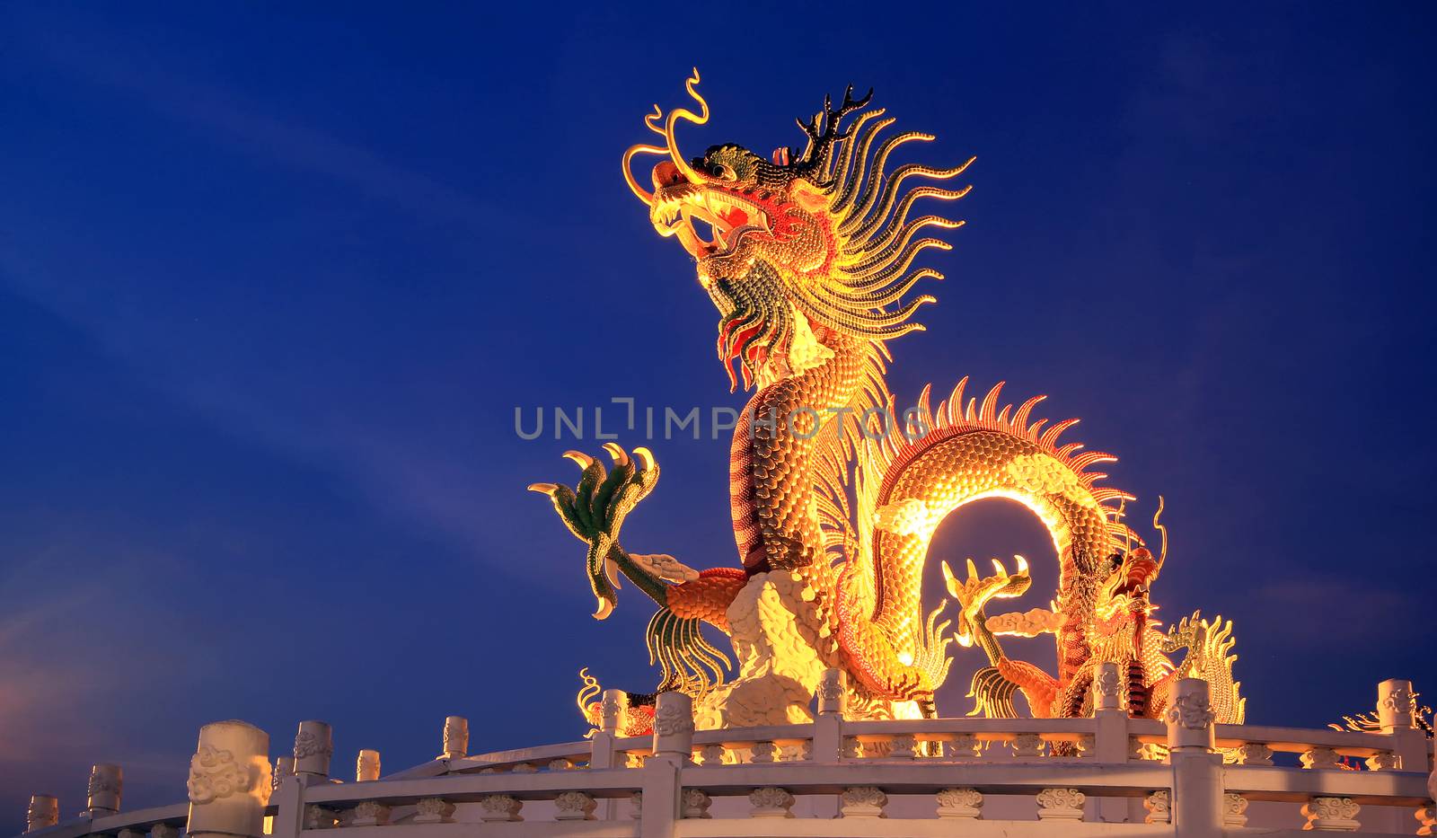 Chinese dragon statue at the twilight time