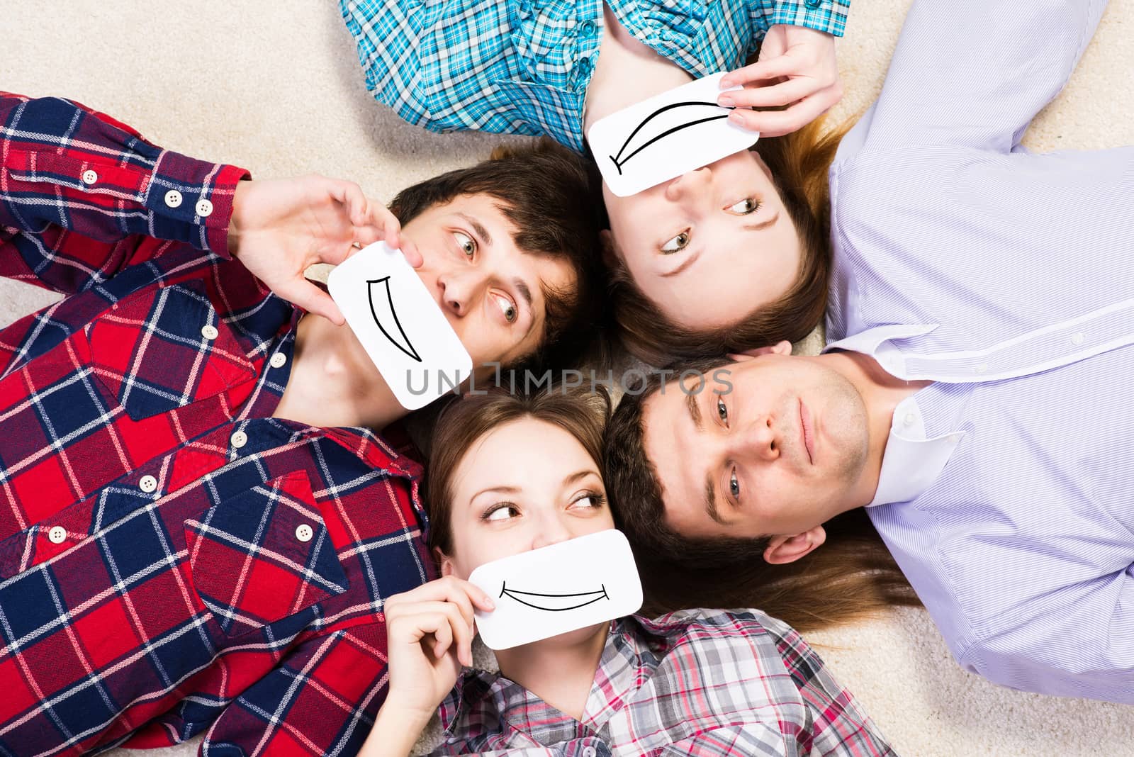 four young men lie together, applied to the face card with smiles