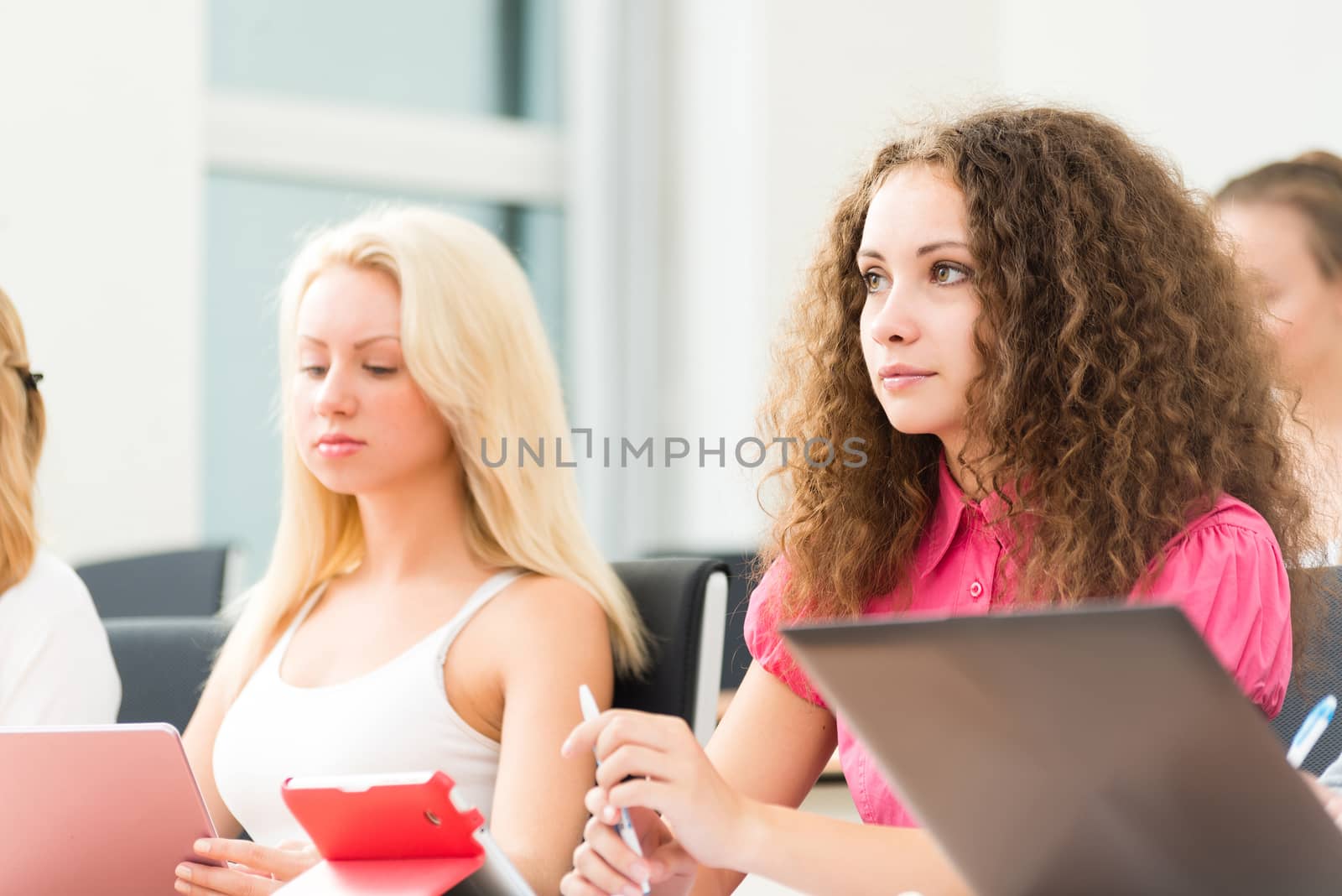 image of a young female student in the classroom, teaching at the University of