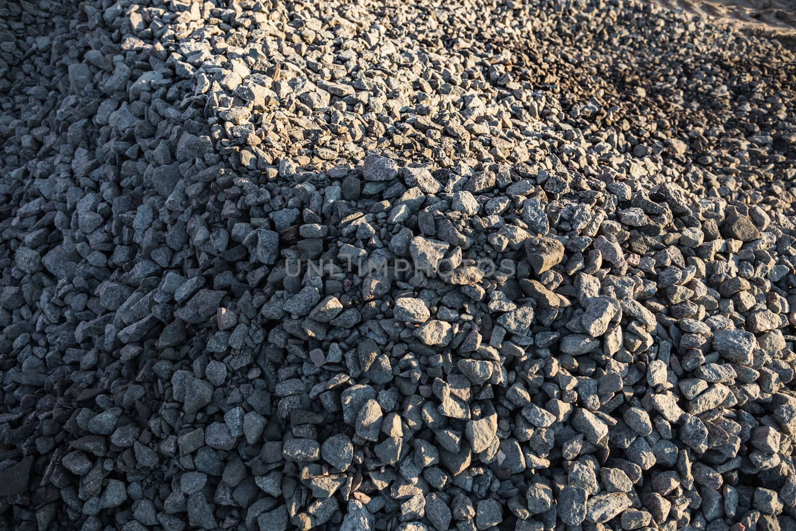 Pile of crushed stones in the sunny day.