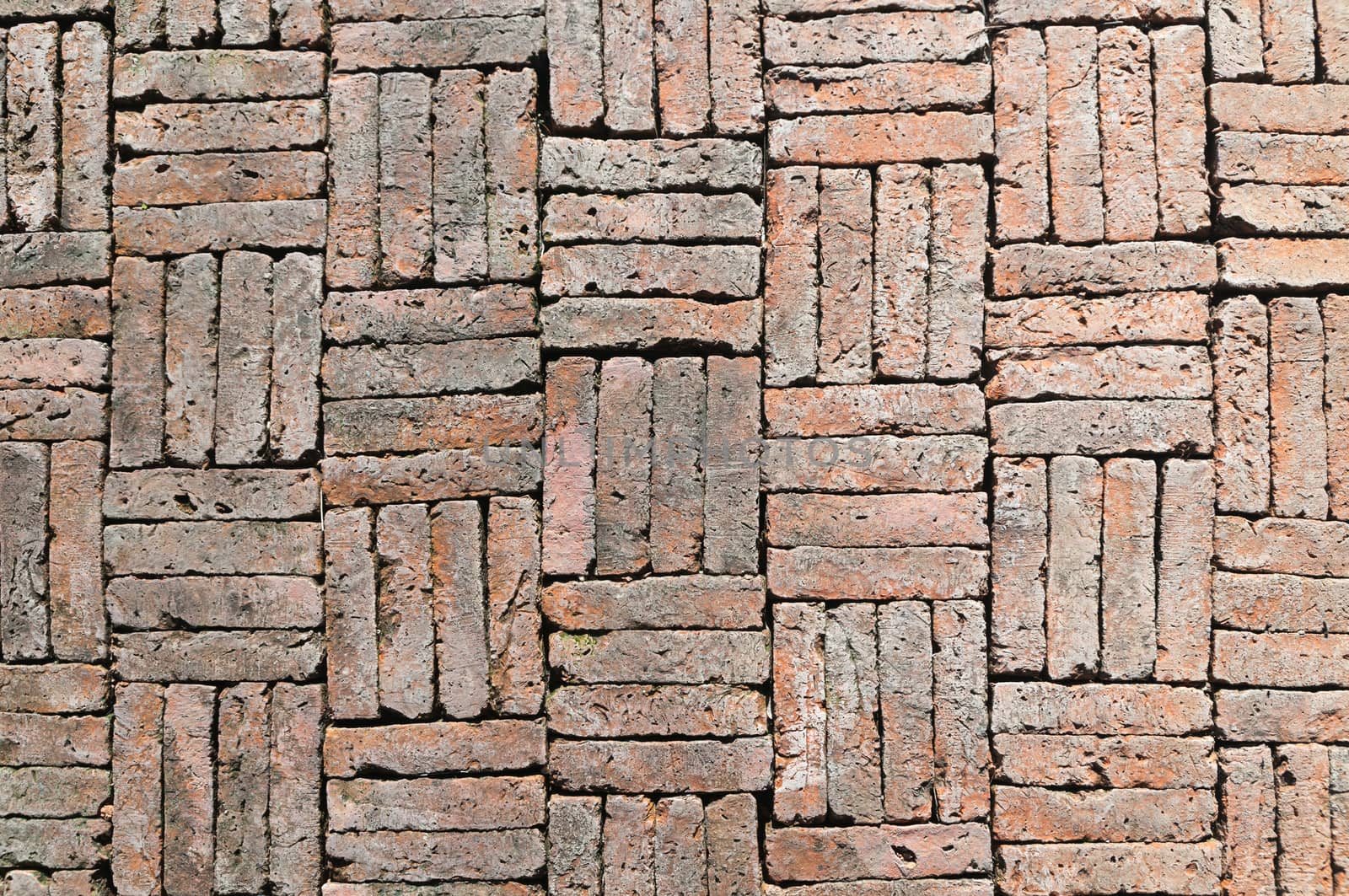 Old weathered red brick wall as background 
