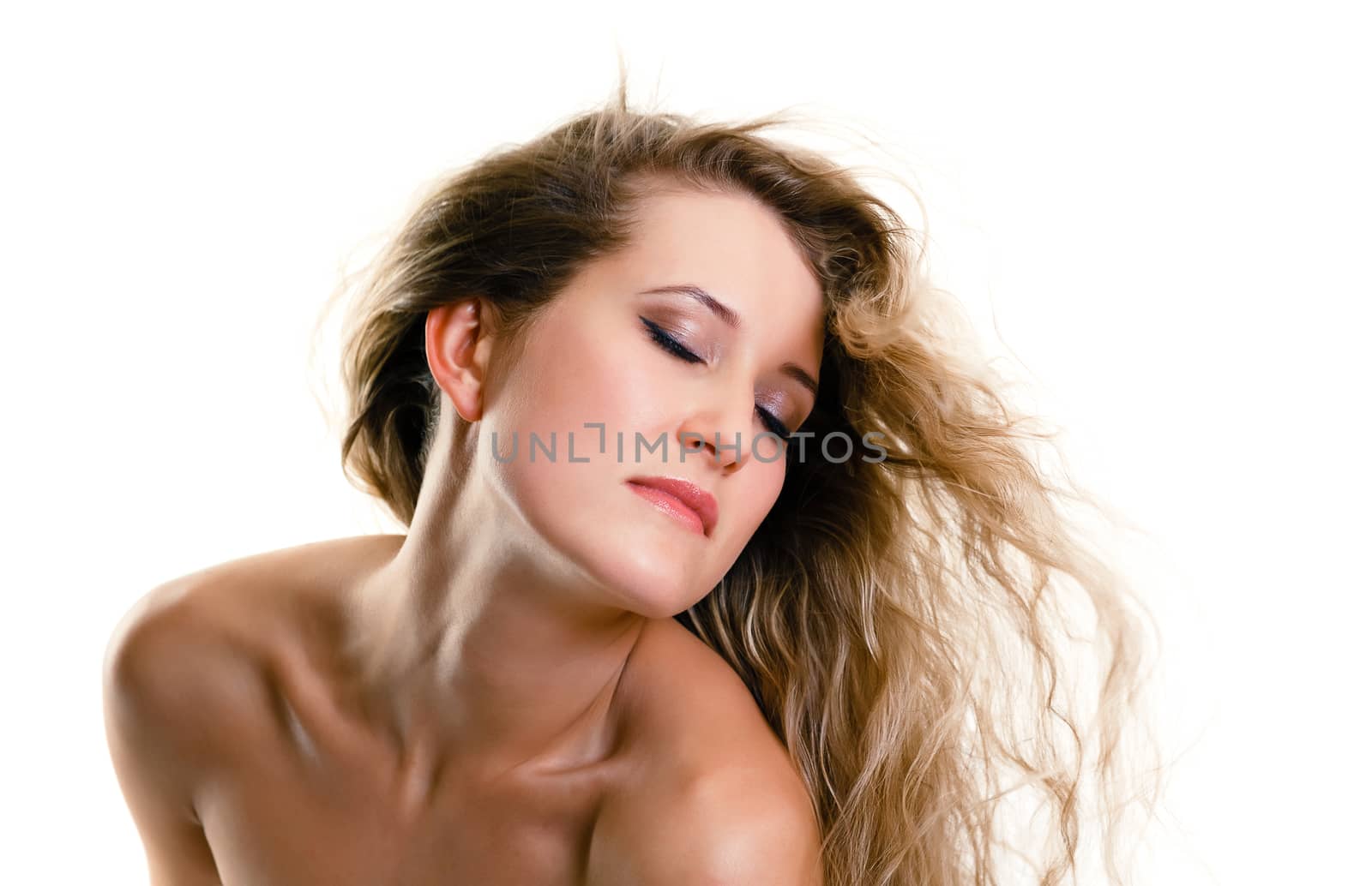 Beautiful girl with closed eyes and flying hair. white background