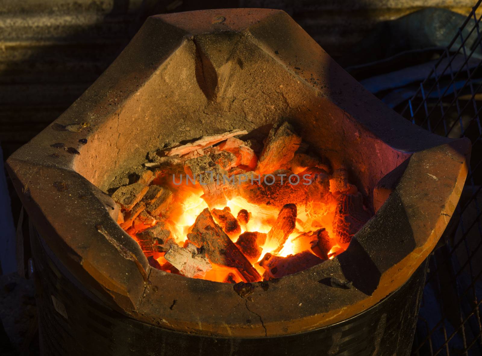Stove with coals burning down and hot