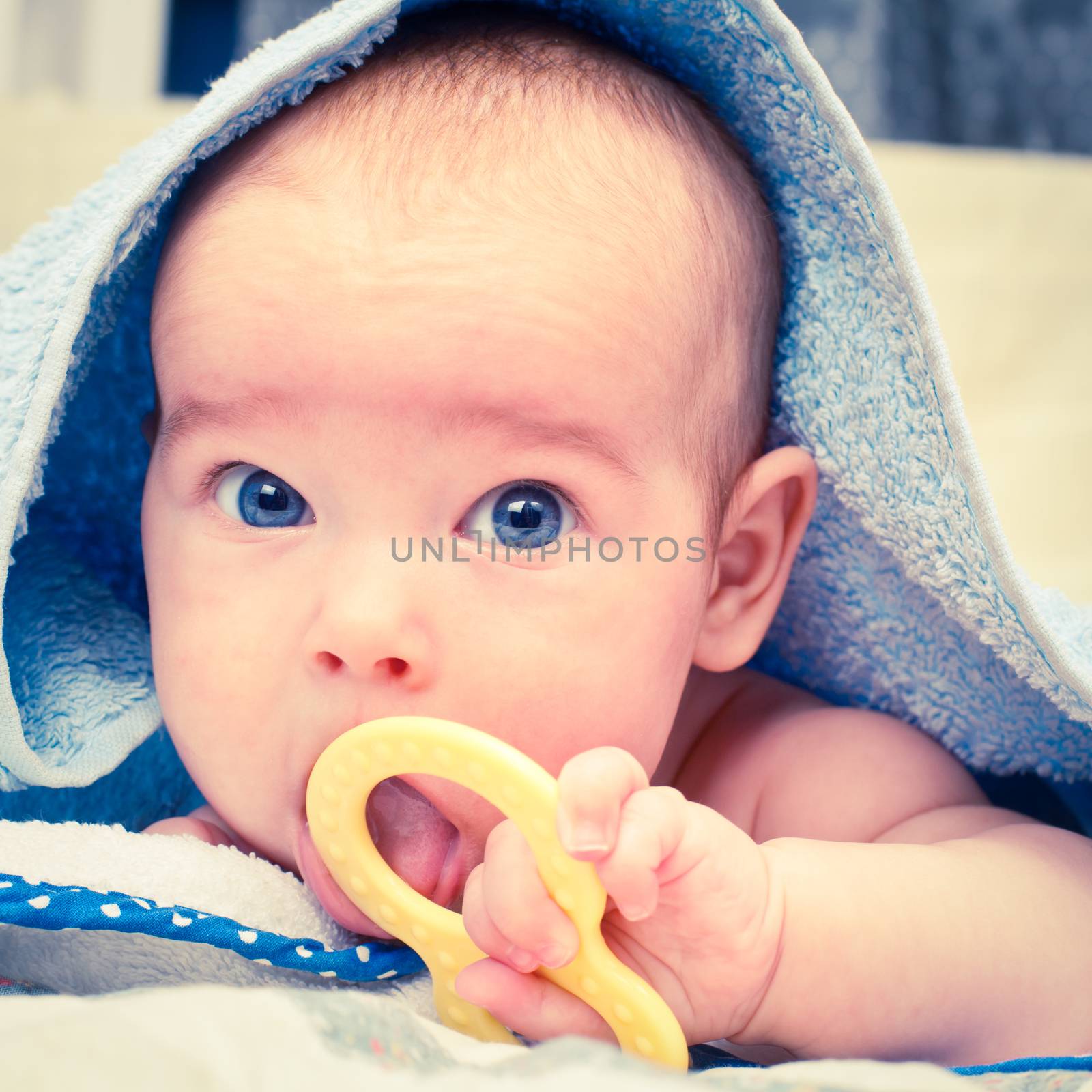Infant with teething toy by naumoid