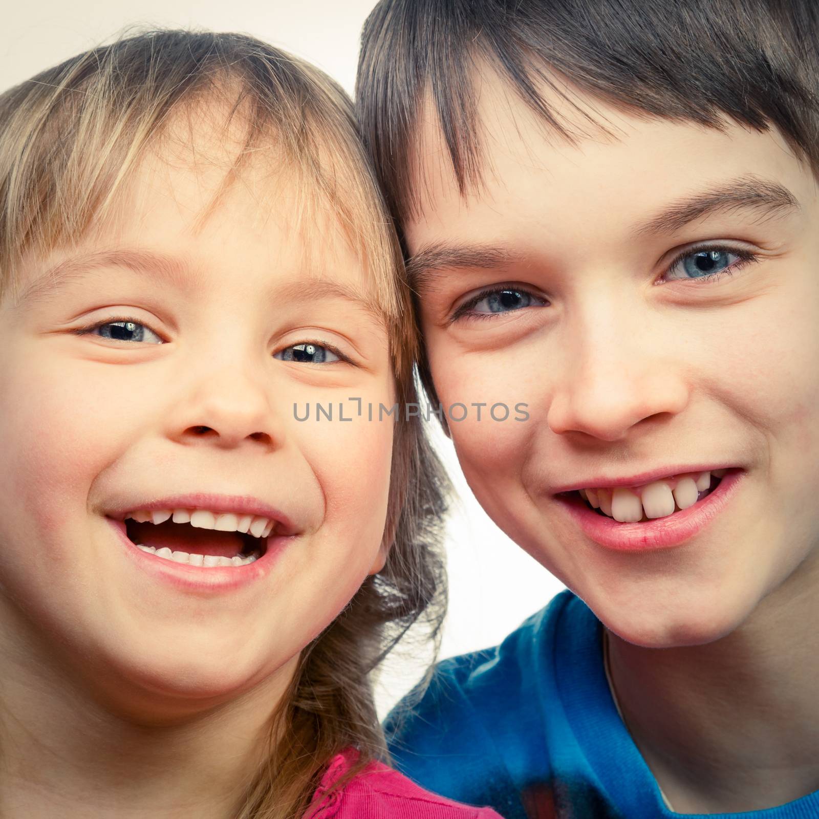 Sister and brother smiling by naumoid