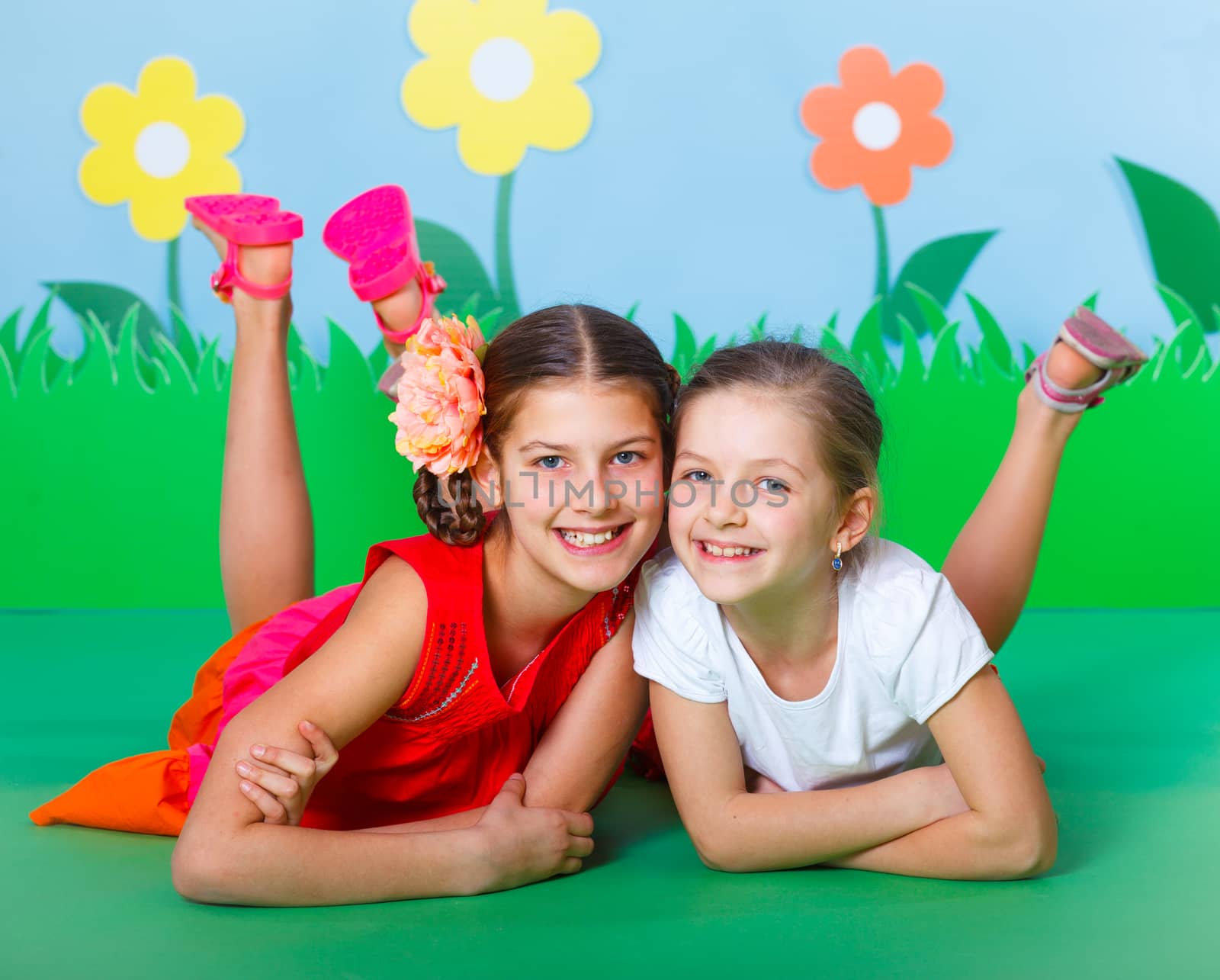 Two Lovely Young girls wearing colorful summer clothing on Fashion and Beauty Summer theme