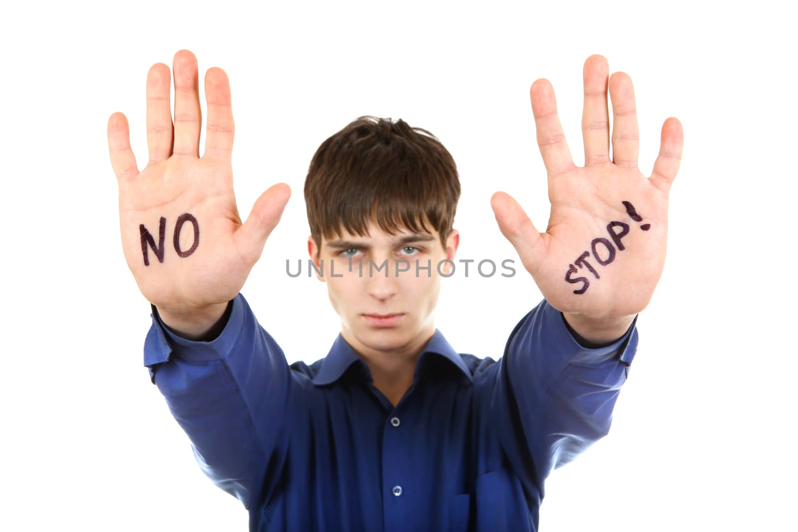 Teenager shows the palm gesture with an inscription No and Stop. Isolated on the White
