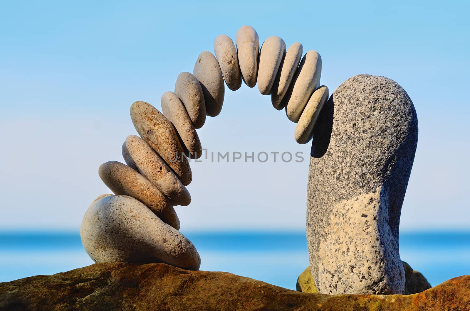 Balancing of pebbles each other on the seacoast