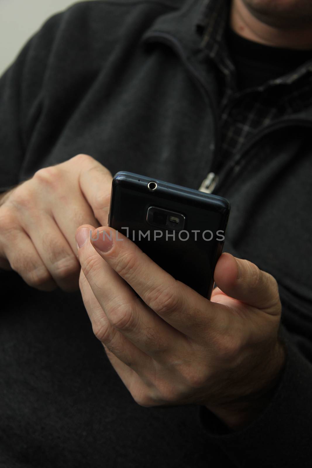 Man with smartphone by studioportosabbia