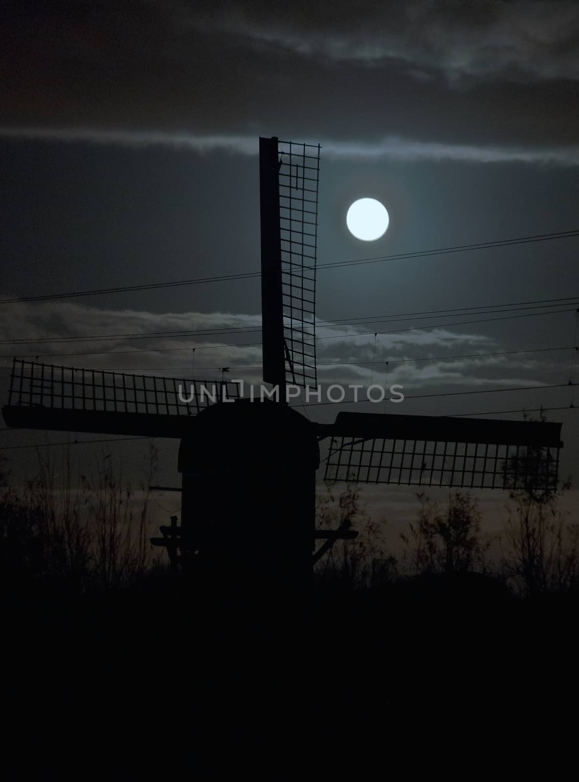 windmill on the background light of the moon